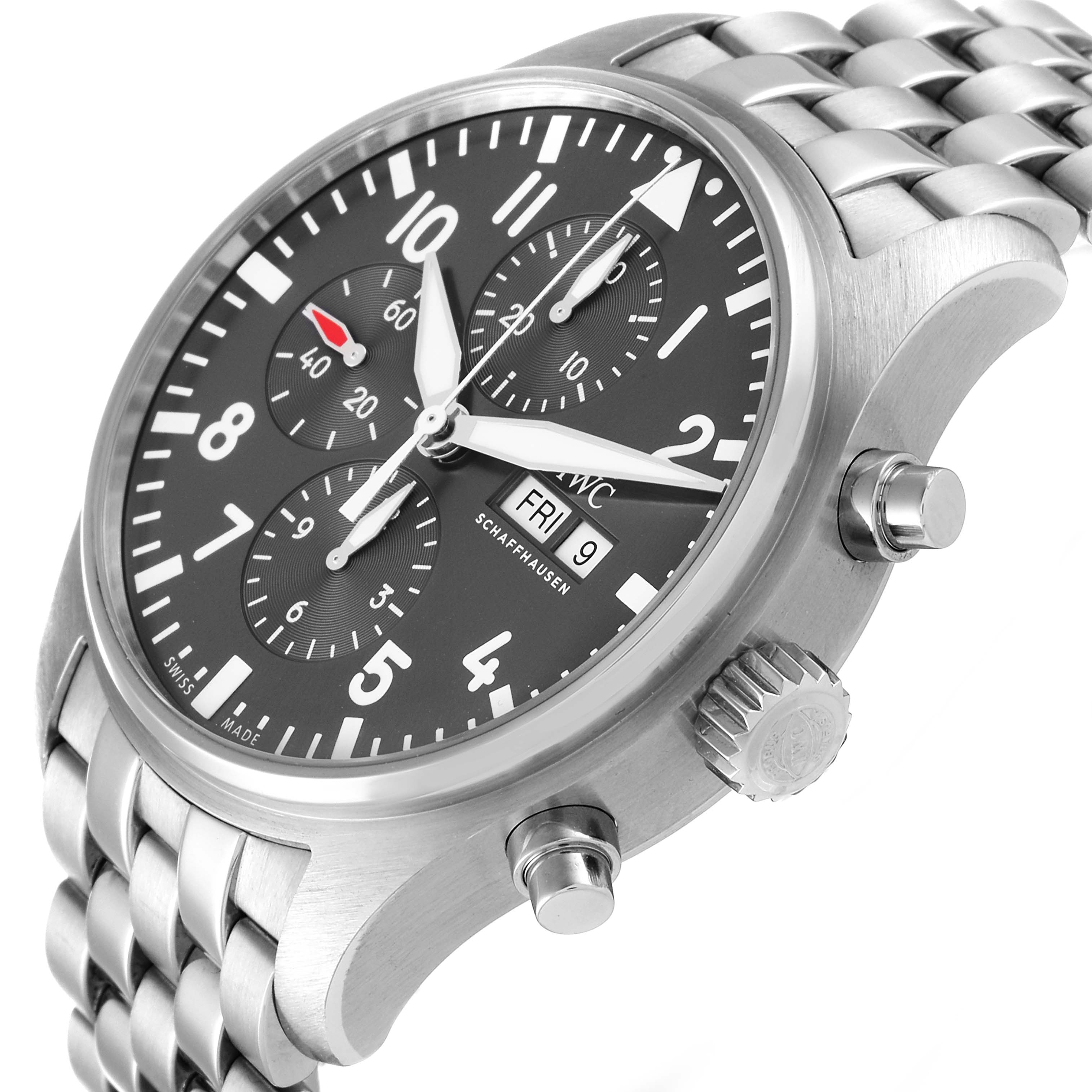 The image displays an IWC Pilot IW388102 Men's Stainless Steel Grey Dial IW388102 Men's Stainless Steel Grey Dial model watch from a three-quarters angle, highlighting its face, crown, pushers, and metal bracelet.