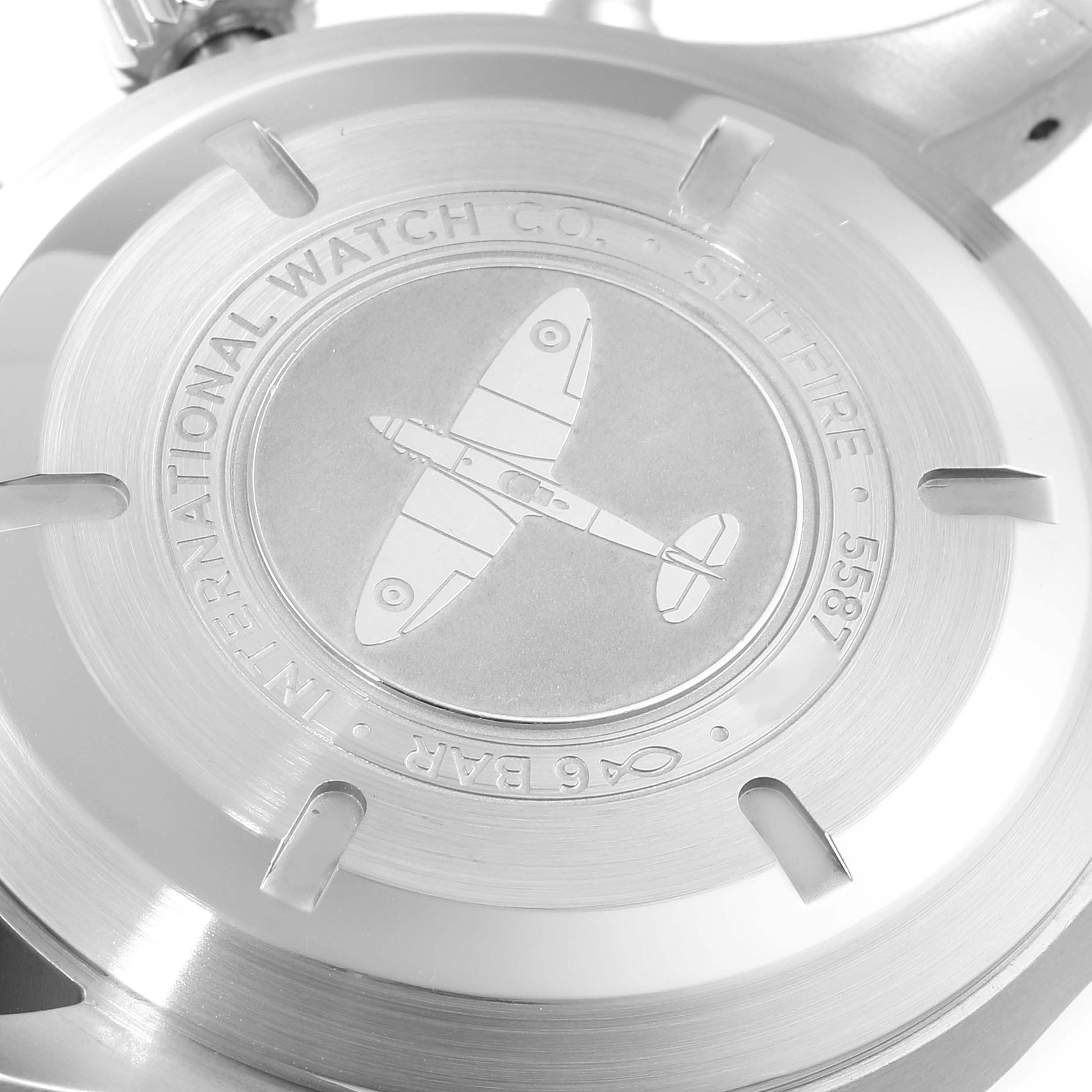 This image shows the back case of the IWC Pilot IW388102 Men's Stainless Steel Grey Dial IW388102 Men's Stainless Steel Grey Dial model watch, displaying an engraved aircraft and text.