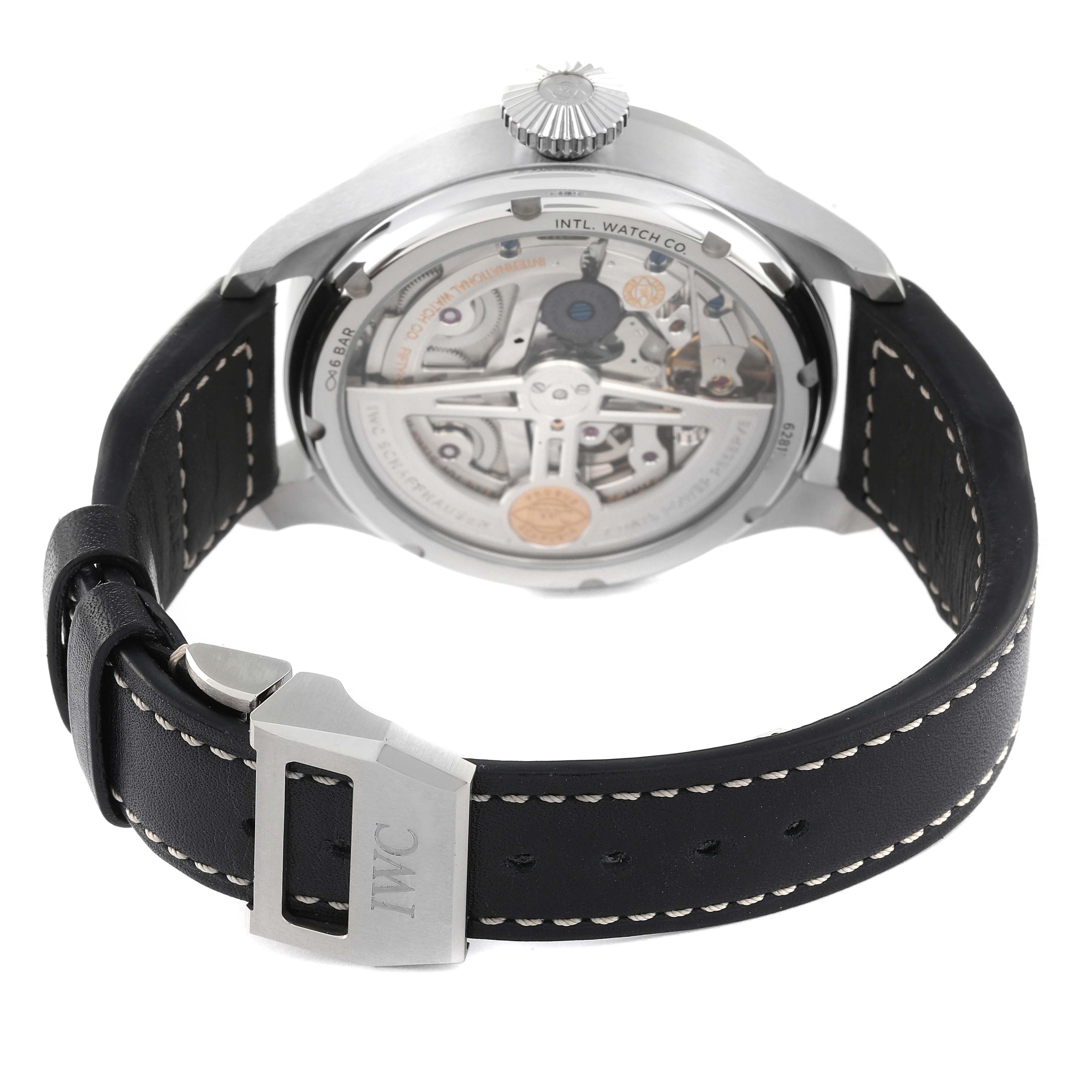 This image shows the back view of the IWC Pilot IW503605 Men's Stainless Steel Blue Dial IW503605 Men's Stainless Steel Blue Dial model watch, highlighting the mechanical movement and leather strap with the IWC logo on the clasp.