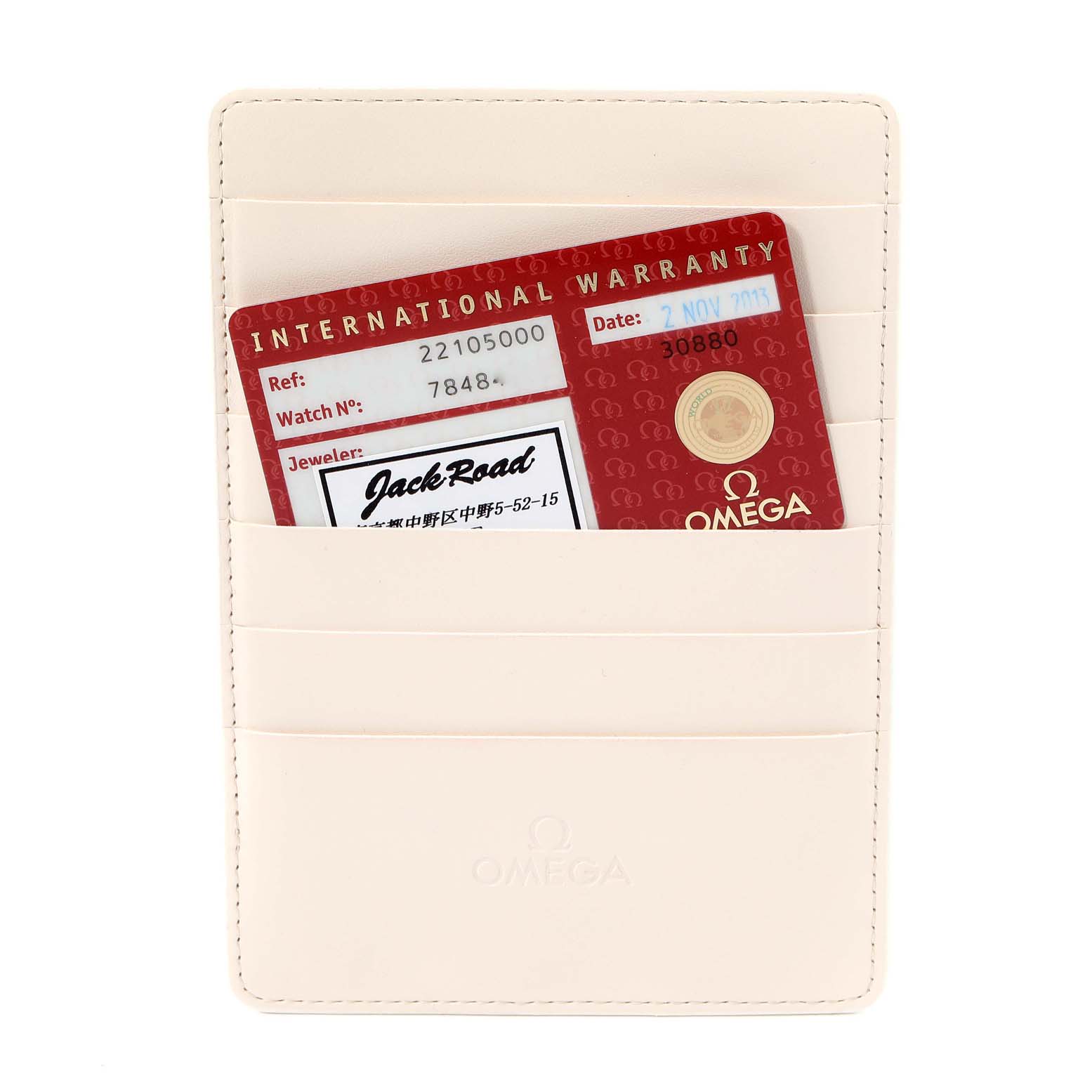 The image shows an Omega Planet Ocean 2210.50.00 Men
s Stainless Steel Black Dial 2210.50.00 Men
s Stainless Steel Black Dial watch
s international warranty card inside a cream-colored cardholder.