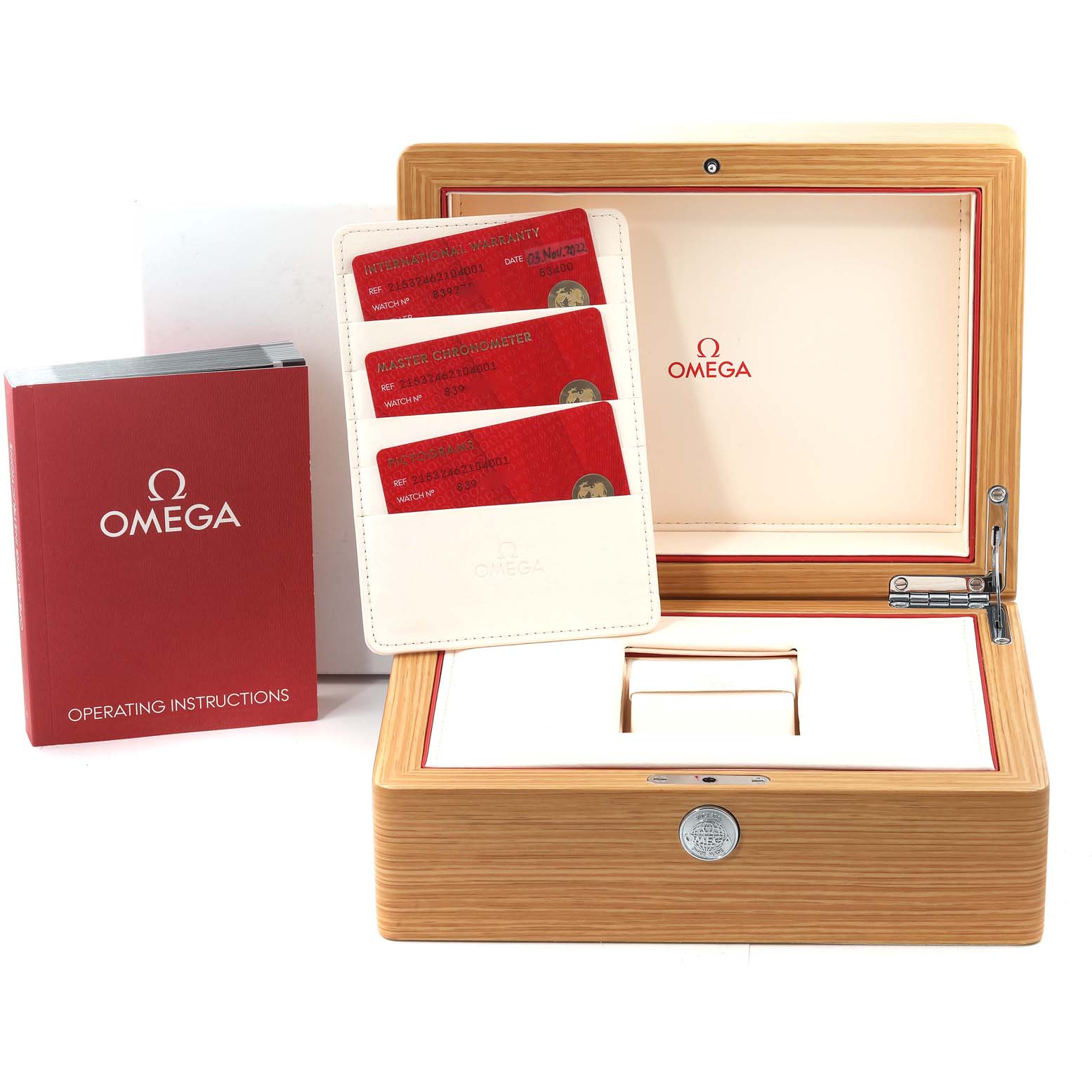 The image shows the Omega Planet Ocean 215.32.46.21.04.001 Men's Stainless Steel White Dial 215.32.46.21.04.001 Men's Stainless Steel White Dial watch box, warranty cards, and operating instructions.