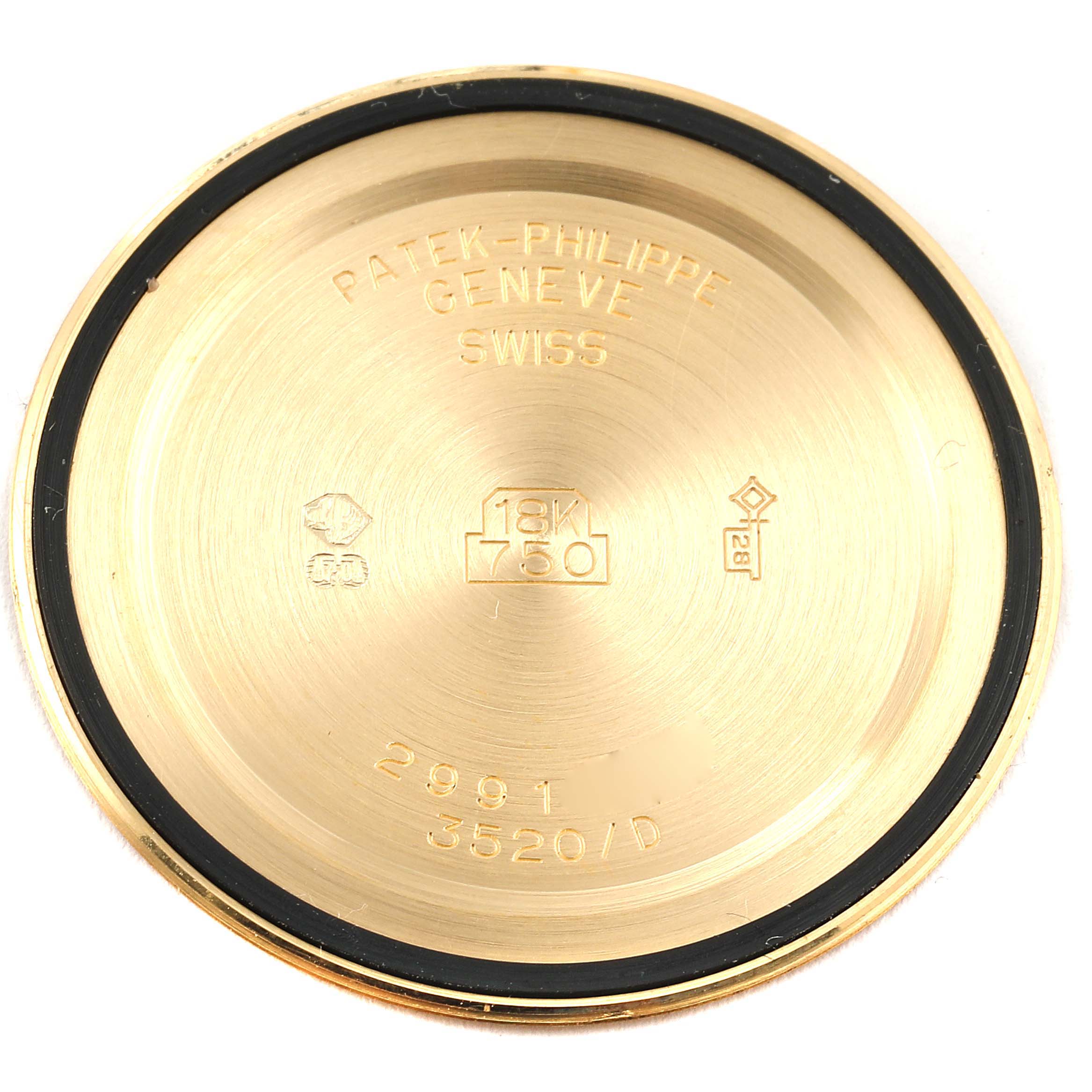 This is the inside view of the case back from a Patek Philippe Calatrava 3520 Men's Yellow Gold White Dial 3520 Men's Yellow Gold White Dial watch, showcasing hallmark stamps and engravings.