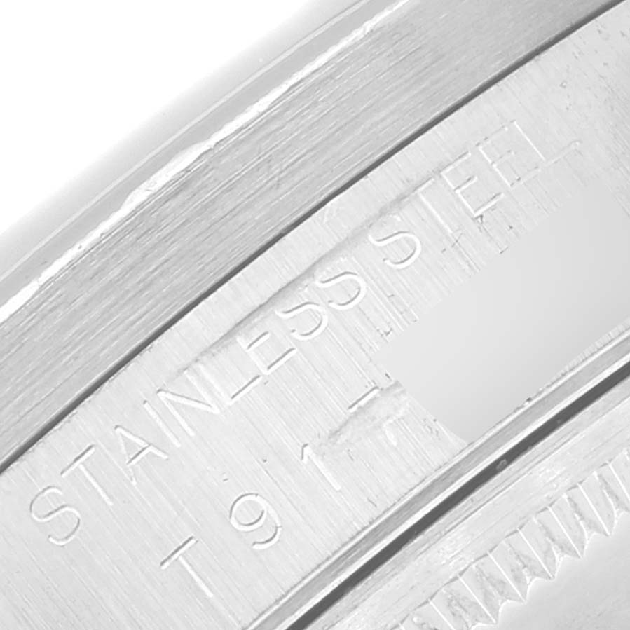 The image shows a close-up of the stainless steel casing with engravings on a Rolex Air-King 14010 Men's Stainless Steel Black Dial 14010 Men's Stainless Steel Black Dial watch.