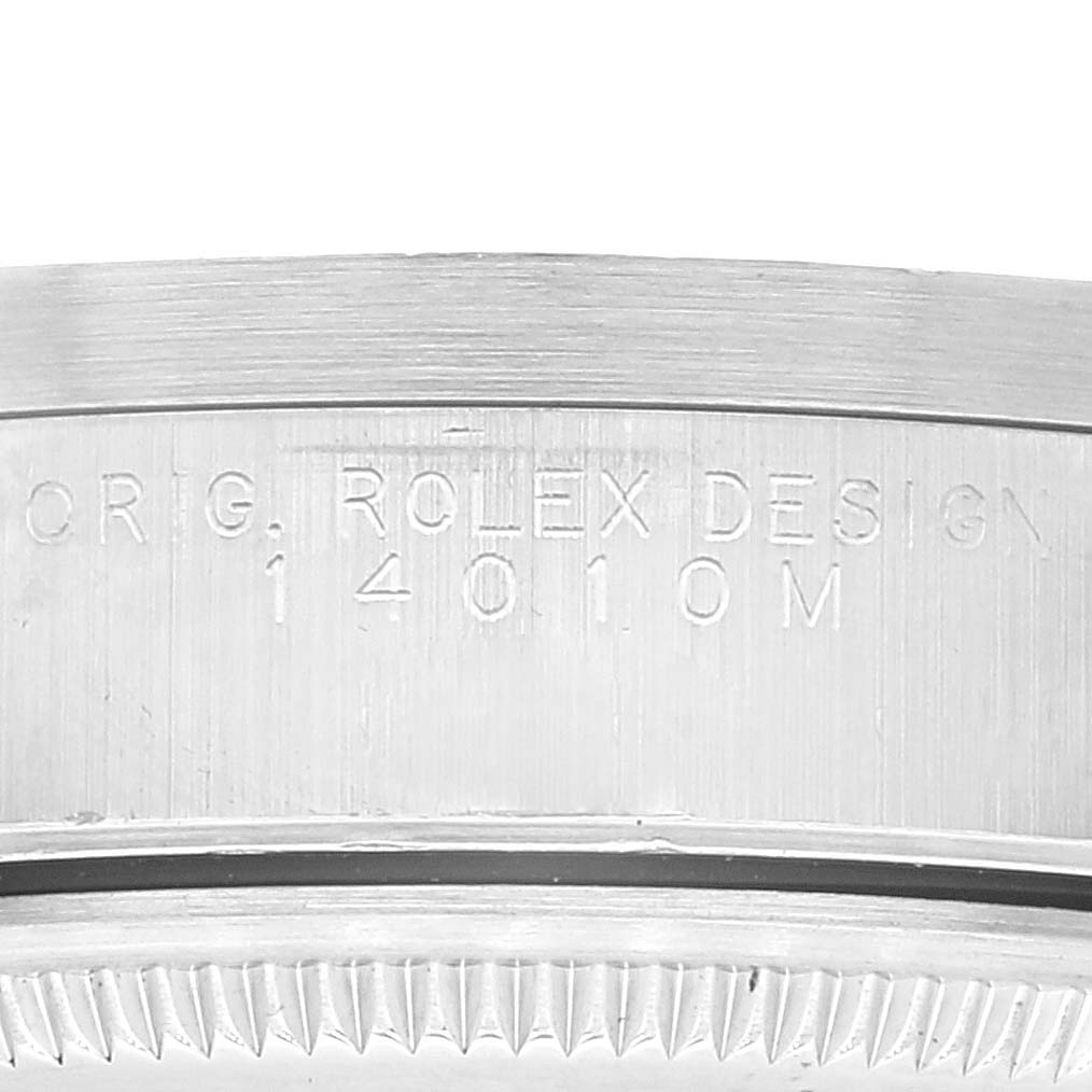 The image shows an angled close-up of the case side engraving of the Rolex Air-King 14010 Men's Stainless Steel Black Dial 14010 Men's Stainless Steel Black Dial watch, displaying the serial and design numbers.