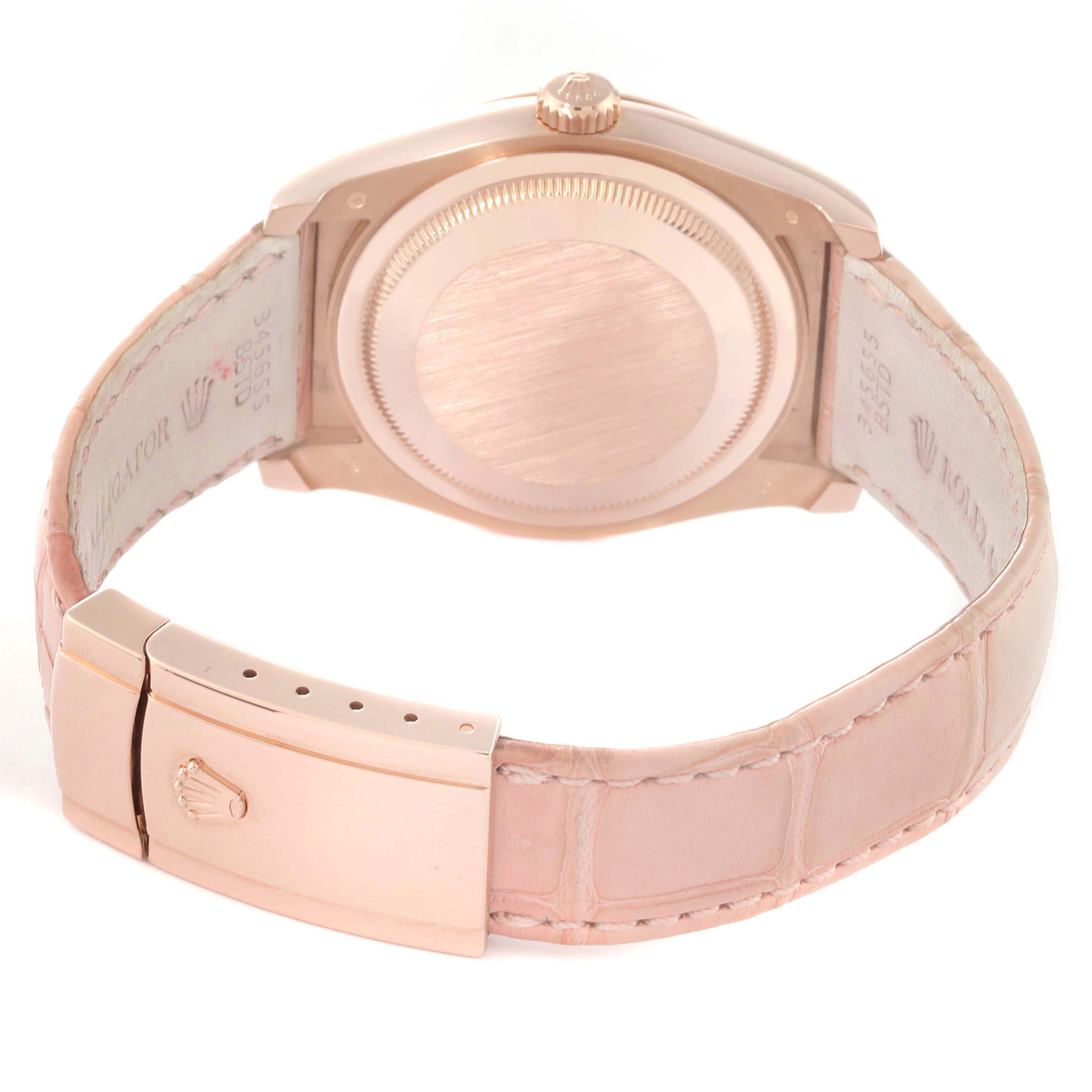 The image shows the back case, crown, and clasp of a Rolex Datejust 116135 Men's Rose Gold Mother of Pearl Dial, viewed from the rear angle.