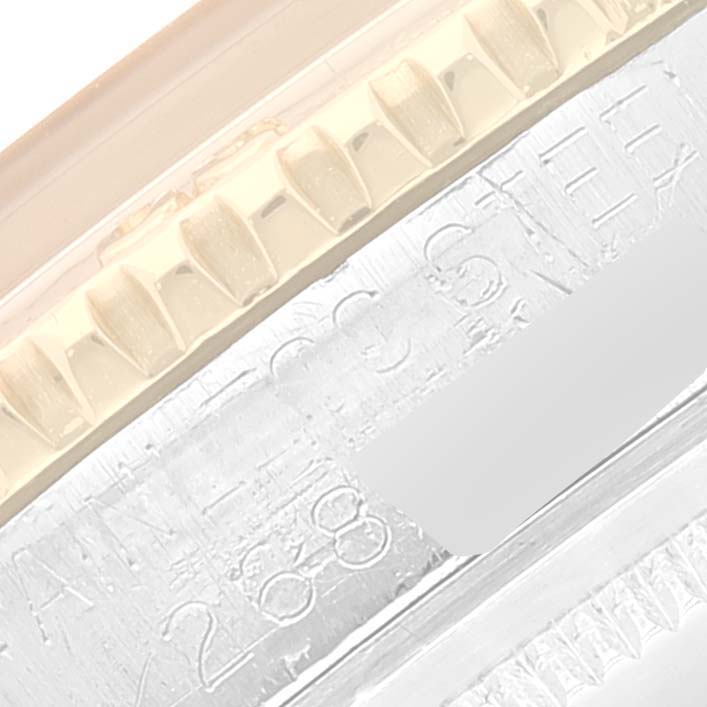 This image shows a close-up of the side, detailing the casing and etched serial number of the Rolex Turn-o-Graph 1625 Men's Steel and Gold (two tone) Silver Dial 1625 Men's Steel and Gold (two tone) Silver Dial watch.