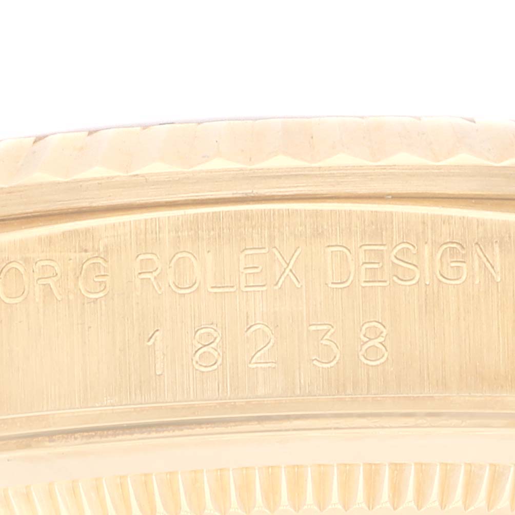 This close-up shows the side of the case on a Rolex President 18238 Men
s Yellow Gold Champagne Dial 18238 Men
s Yellow Gold Champagne Dial model watch, highlighting the engraved model number.