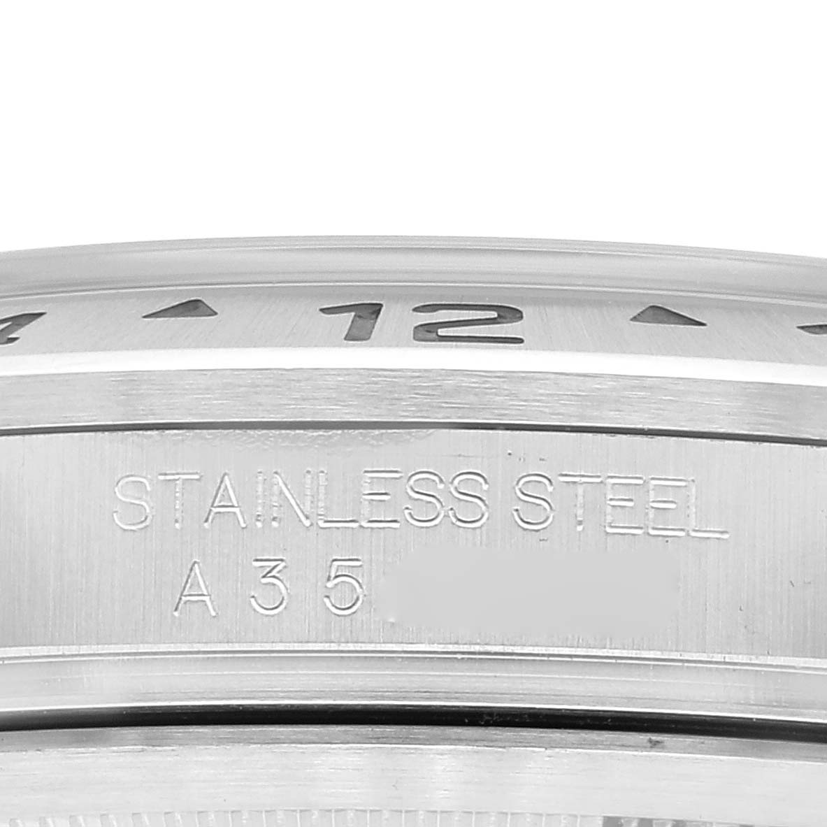 The image shows a close-up of the bezel and case side of the Rolex Explorer 16570 Men's Stainless Steel White Dial 16570 Men's Stainless Steel White Dial watch, highlighting the stainless steel engraving.