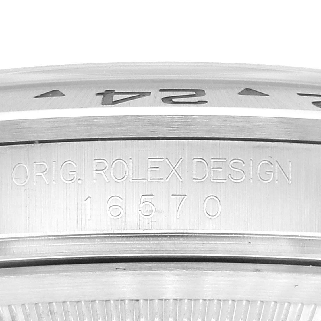 The image shows a close-up view of the side of a Rolex Explorer 16570 Men's Stainless Steel White Dial 16570 Men's Stainless Steel White Dial, featuring the model number and "ORIG. ROLEX DESIGN" engraving.
