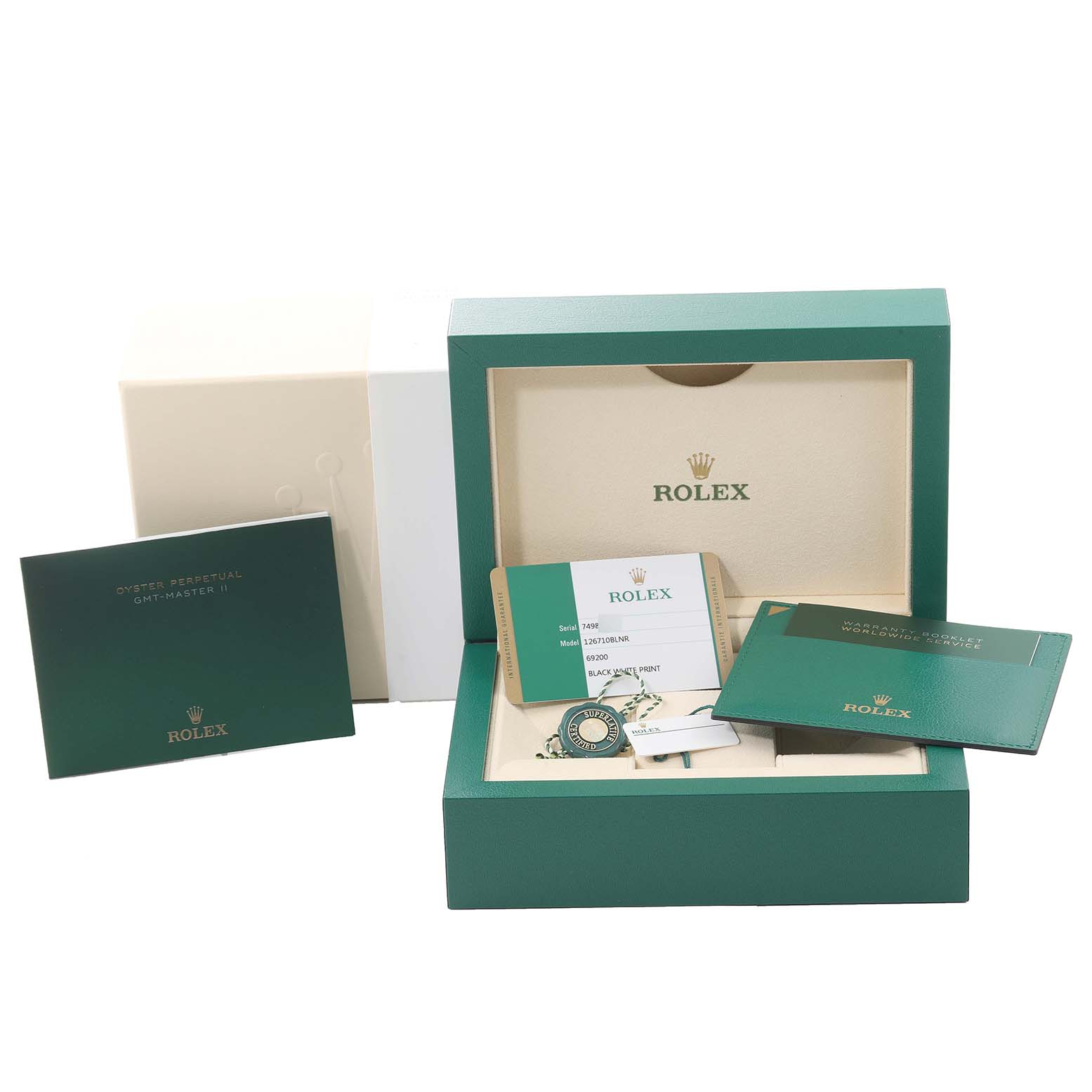 This image shows the box and documentation accessories for a Rolex GMT-Master 126710 Men
s Stainless Steel Black Dial 126710 Men
s Stainless Steel Black Dial watch displayed at an angle.