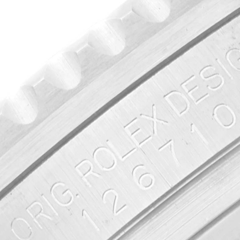 This image shows a close-up of the watch casing edge and engravings on a Rolex GMT-Master 126710 Men
s Stainless Steel Black Dial 126710 Men
s Stainless Steel Black Dial.