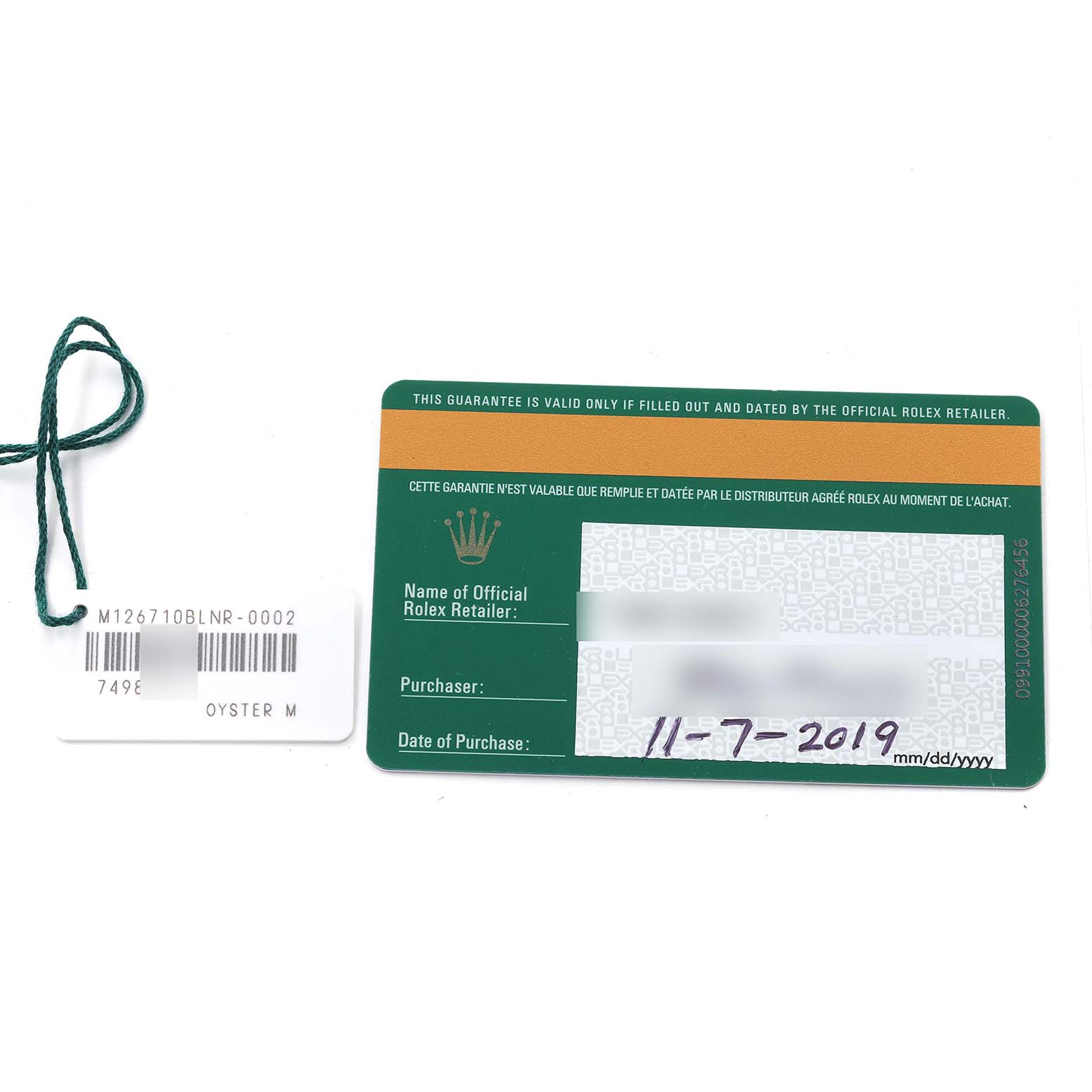 This image shows the warranty card and hang tag for a Rolex GMT-Master 126710 Men
s Stainless Steel Black Dial 126710 Men
s Stainless Steel Black Dial model.