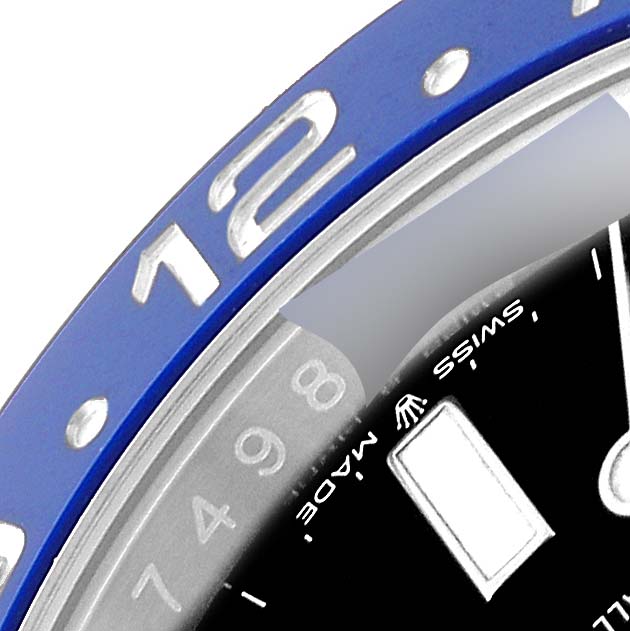 The image shows a close-up of the bezel and part of the dial of a Rolex GMT-Master 126710 Men
s Stainless Steel Black Dial 126710 Men
s Stainless Steel Black Dial watch.