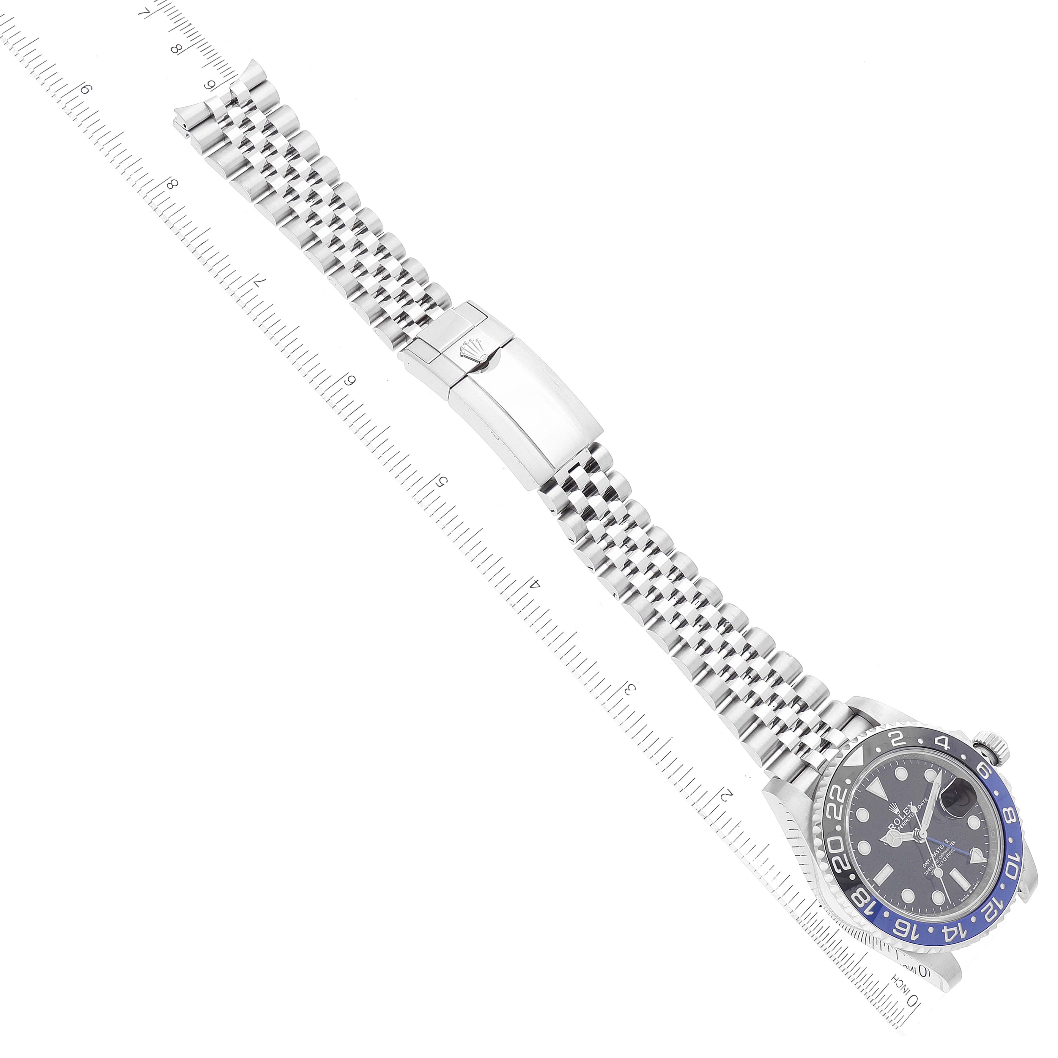 The image shows a top-down view of a Rolex GMT-Master 126710 Men
s Stainless Steel Black Dial 126710 Men
s Stainless Steel Black Dial watch, highlighting its bracelet, clasp, and blue-black bezel.