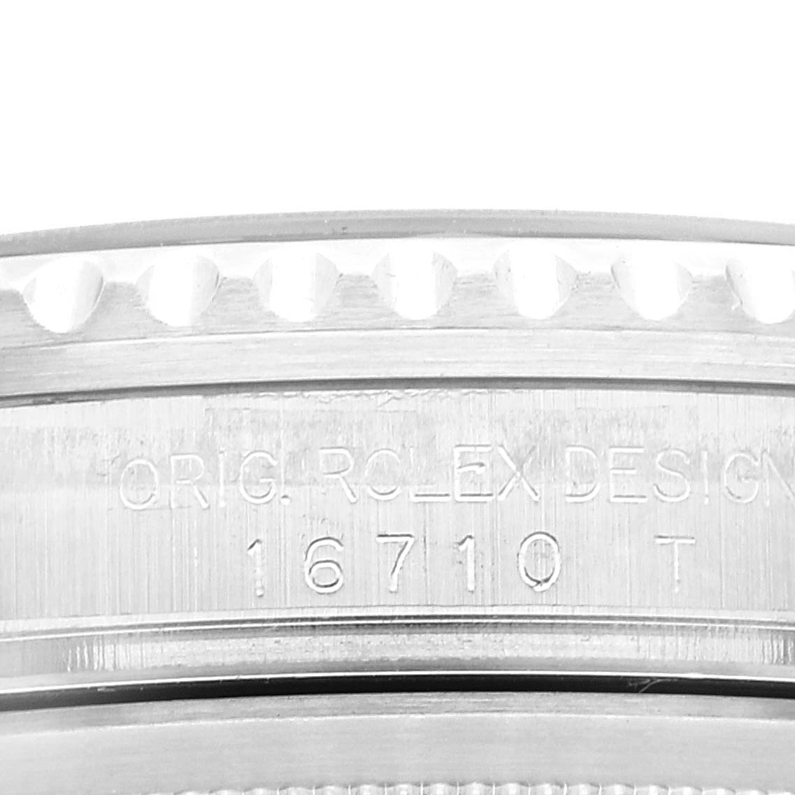 This close-up image shows the side of the case, specifically the model number engraving, of a Rolex GMT-Master 16710 Men's Stainless Steel Black Dial 16710 Men's Stainless Steel Black Dial watch.