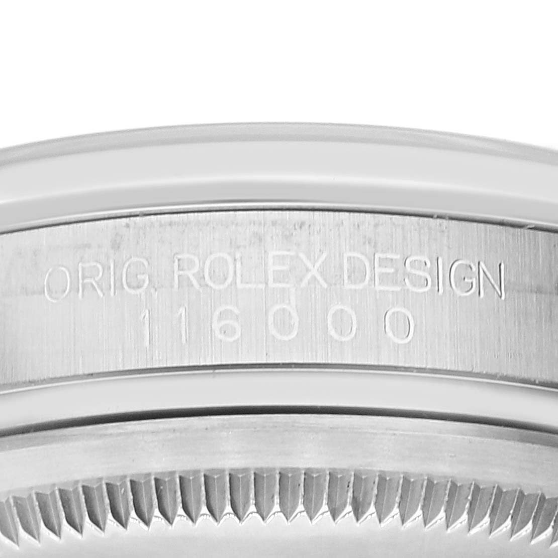 This image shows a close-up view of the engraved model number and design details on the case of a Rolex Oyster Perpetual 116000 Men's Stainless Steel Blue Dial 116000 Men's Stainless Steel Blue Dial watch.