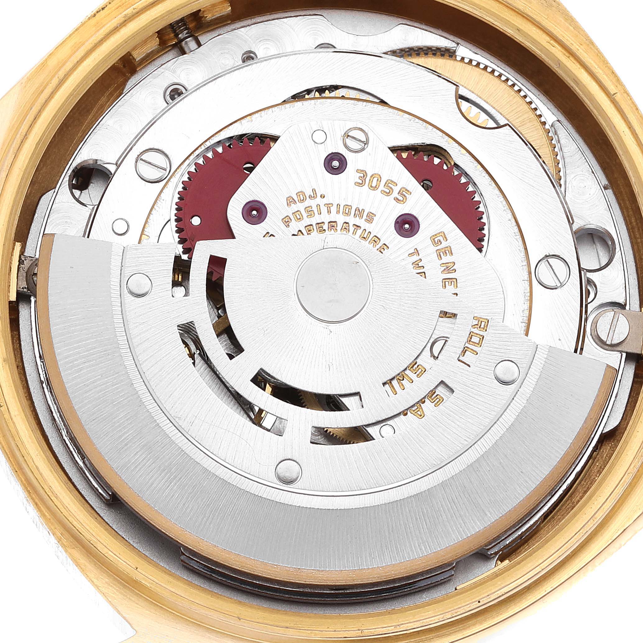 The image shows a close-up view of the internal movement mechanism of the Rolex President 18038 Men's Yellow Gold Champagne Dial 18038 Men's Yellow Gold Champagne Dial model watch, displaying gears and other intricate parts.