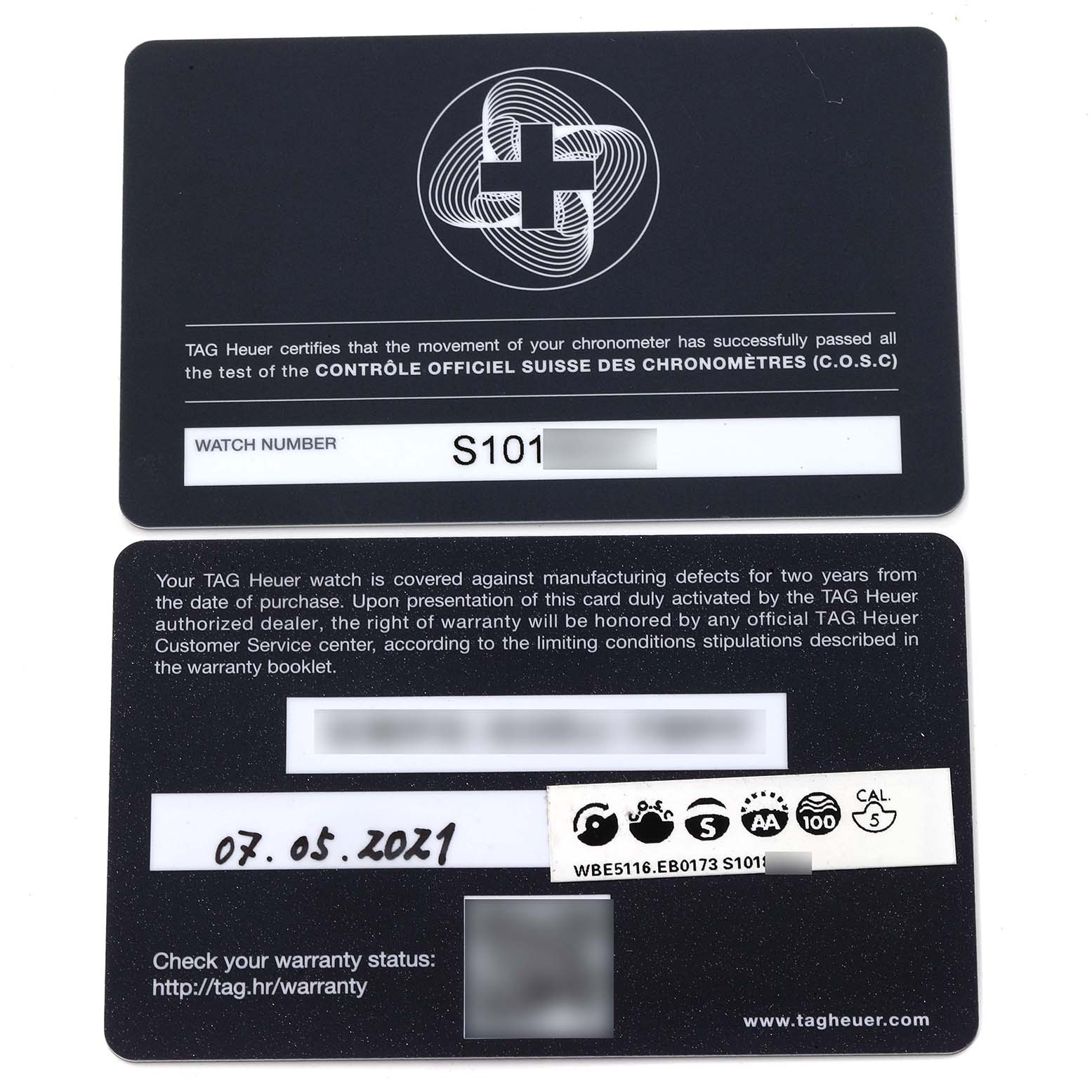 The image shows warranty cards for the Tag Heuer Autavia WBE5116.EB0173 Men's Stainless Steel Blue Dial WBE5116.EB0173 Men's Stainless Steel Blue Dial model, displaying the watch number and date of purchase.