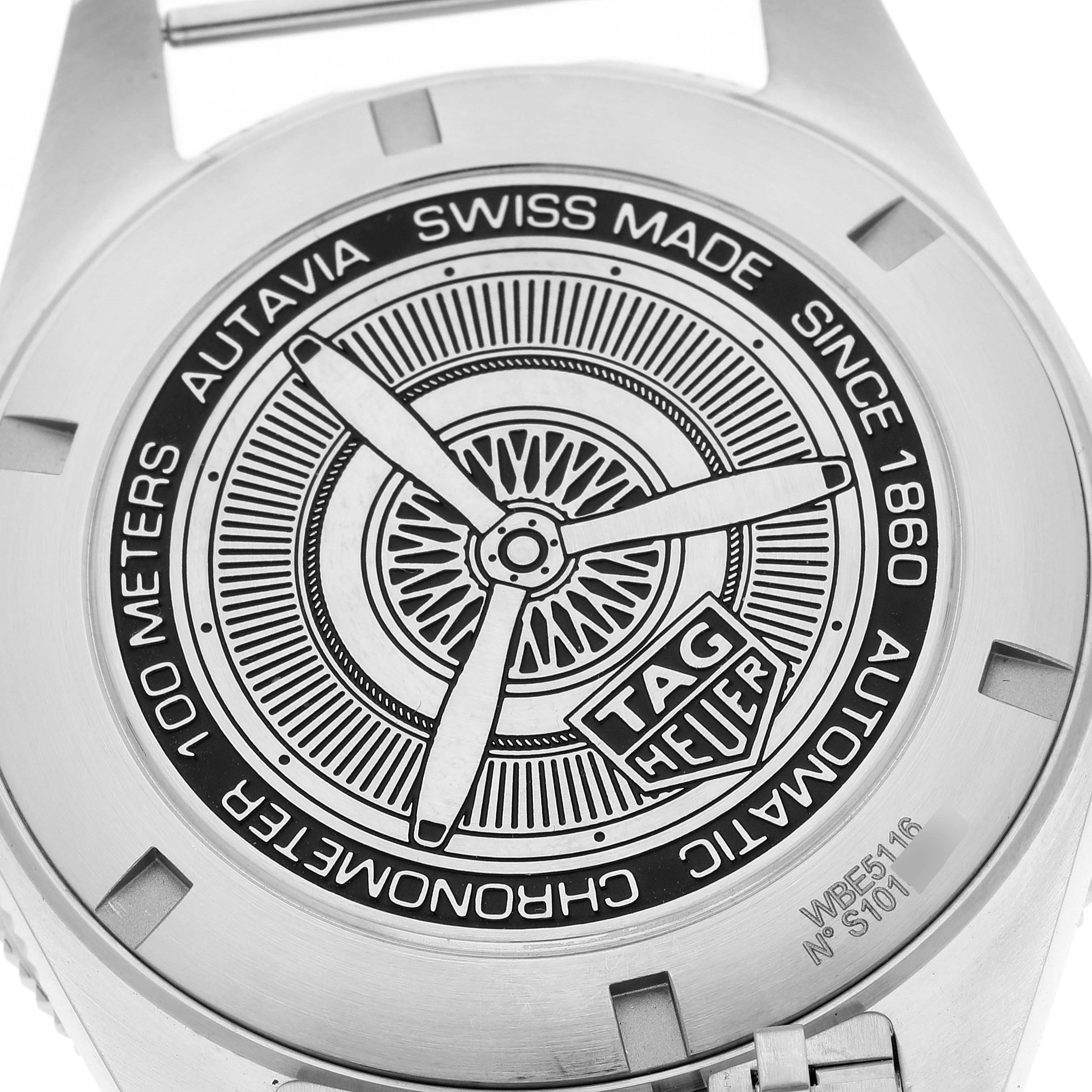 This image shows the back case of a Tag Heuer Autavia WBE5116.EB0173 Men's Stainless Steel Blue Dial WBE5116.EB0173 Men's Stainless Steel Blue Dial watch, featuring an intricate design and branding.
