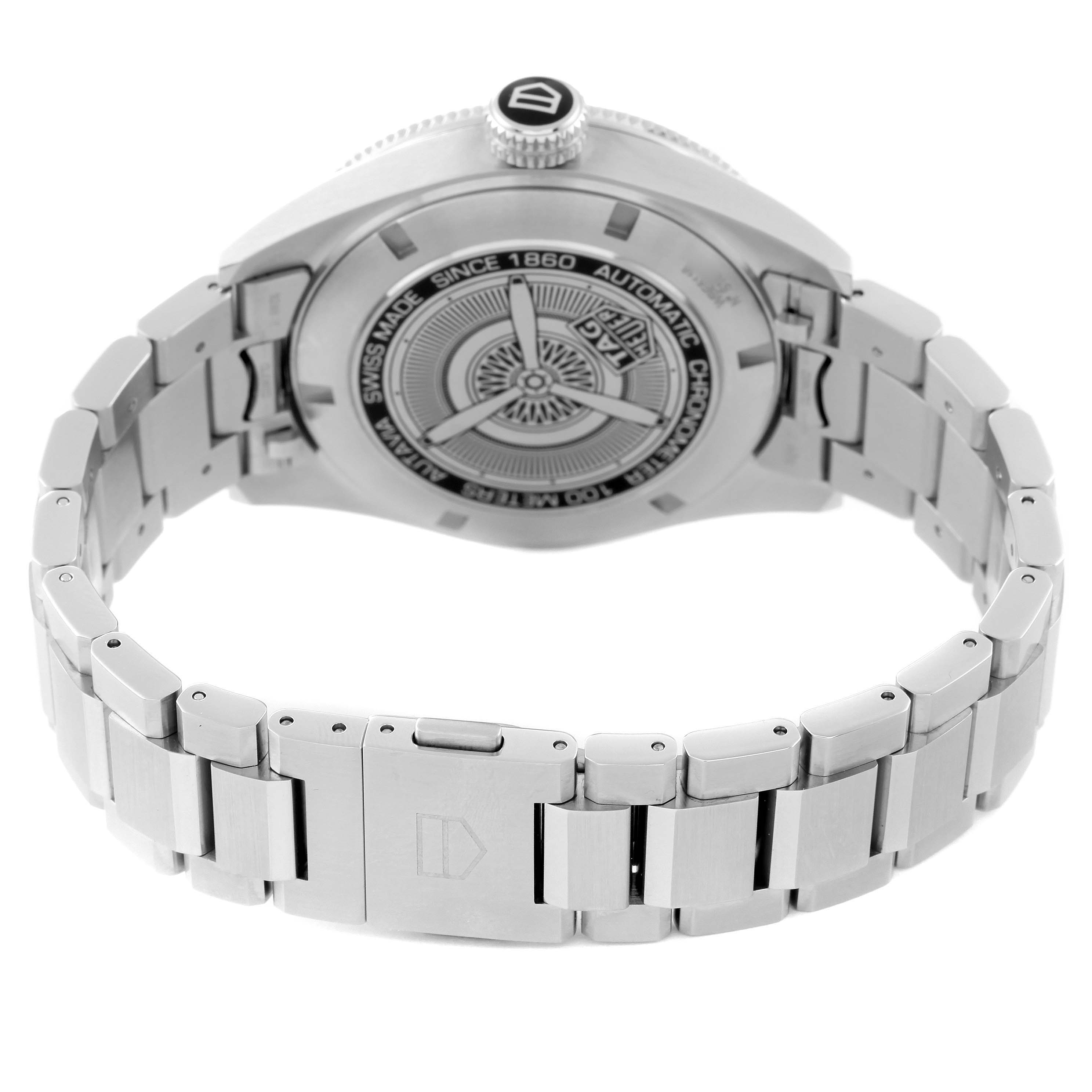 The image shows the back side of the Tag Heuer Autavia WBE5116.EB0173 Men's Stainless Steel Blue Dial WBE5116.EB0173 Men's Stainless Steel Blue Dial watch and its metal bracelet.