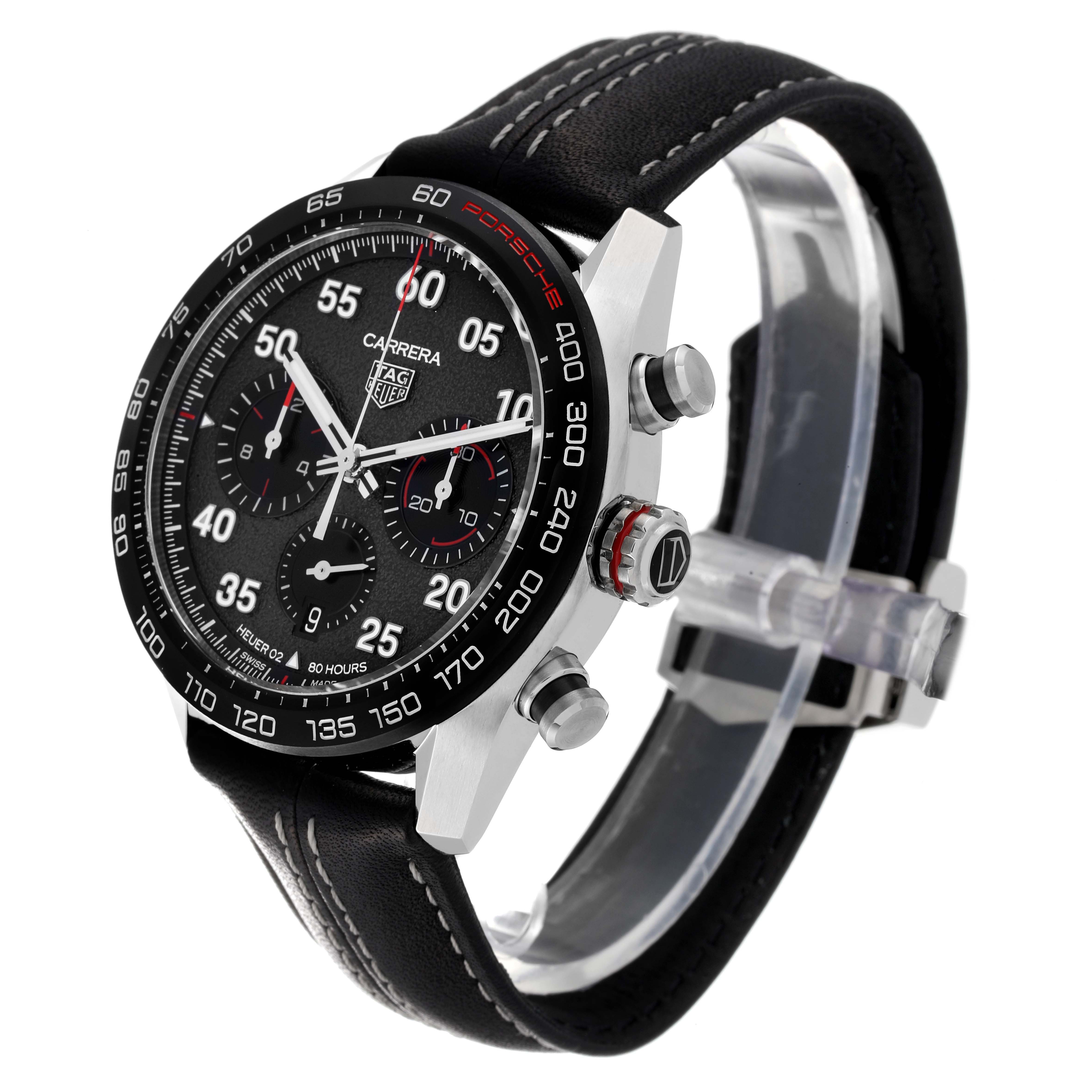 The image shows a front angle of the Tag Heuer Carrera Limited Edition watch, highlighting its black dial, chronograph, bezel, and leather strap.