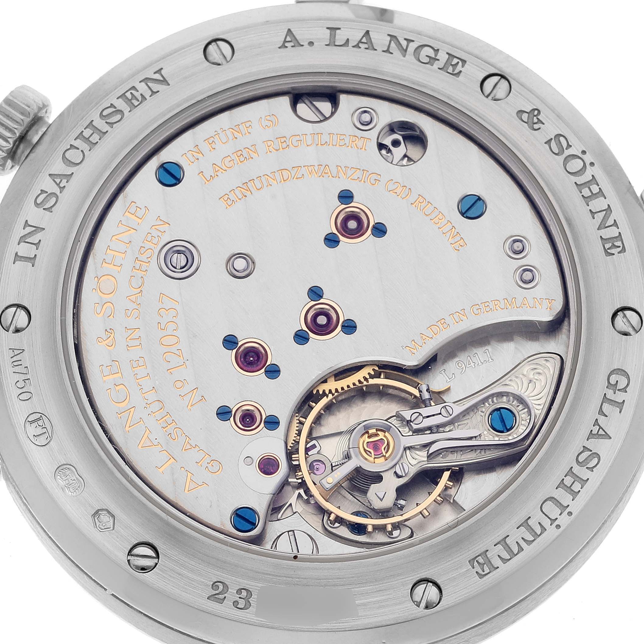 The image shows the back view of the A. Lange 
Sohne Saxonia 219.026 Men
s White Gold Silver Dial, highlighting its intricate movement and engravings.