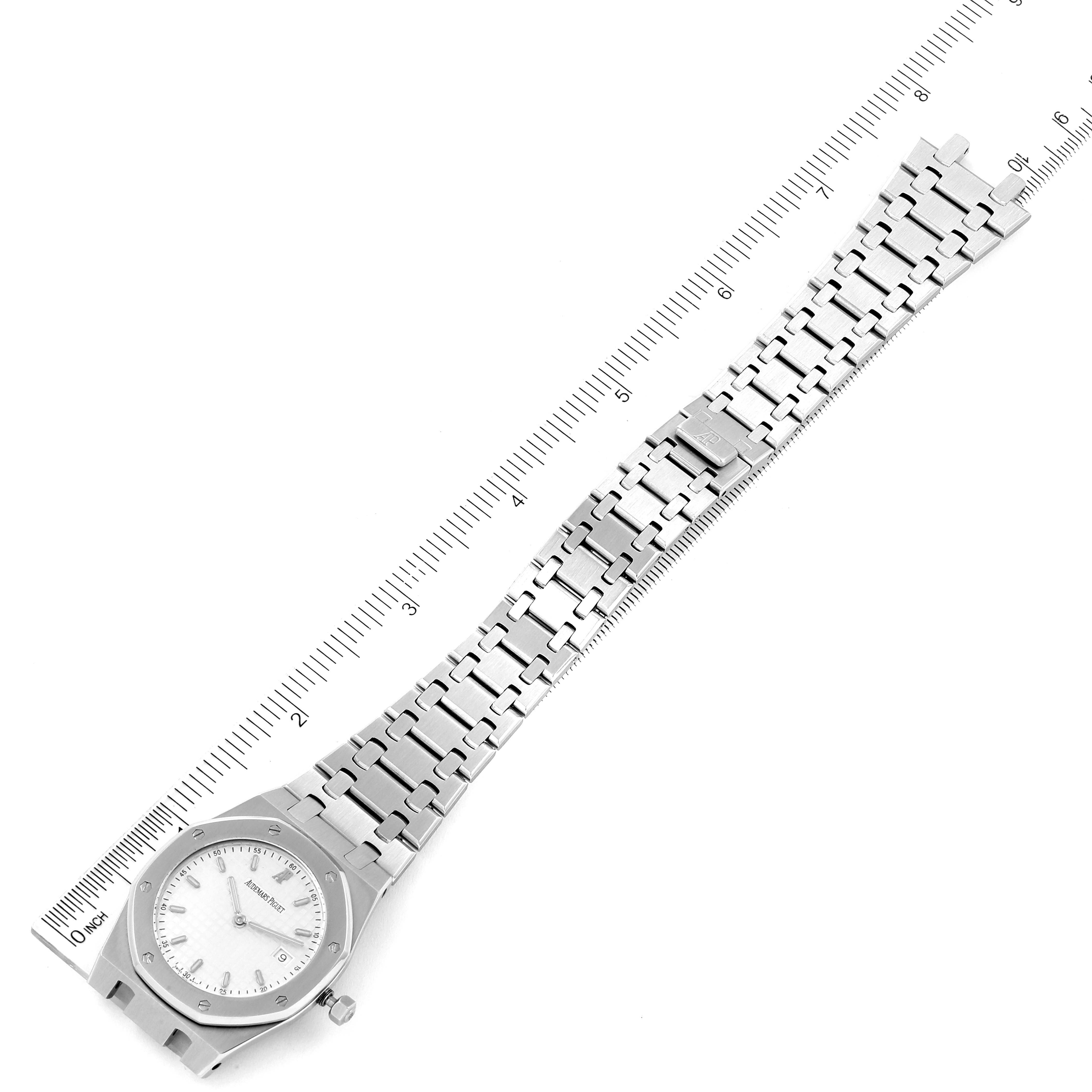 The image shows a full-length view of the Audemars Piguet Royal Oak 56175ST-O-0789ST-08 Men's Stainless Steel Silver Dial 56175ST-O-0789ST-08 Men's Stainless Steel Silver Dial watch laid flat with a metal bracelet and ruler for scale.