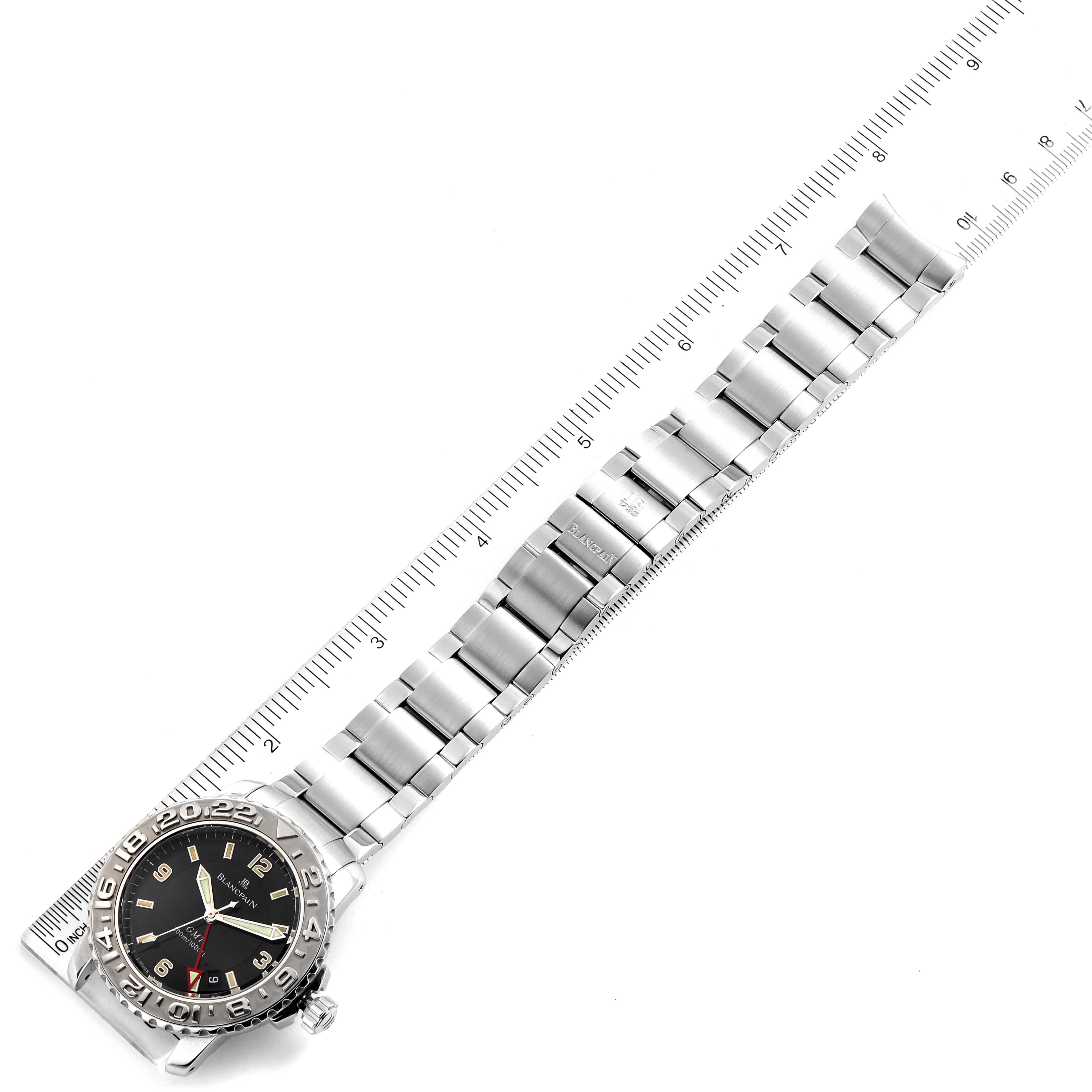 The image shows a Blancpain Fifty Fathoms 2250-1130-71 Men's Stainless Steel Black Dial 2250-1130-71 Men's Stainless Steel Black Dial watch from an aerial angle, featuring its face, bezel, and full metal bracelet, aligned with a ruler.