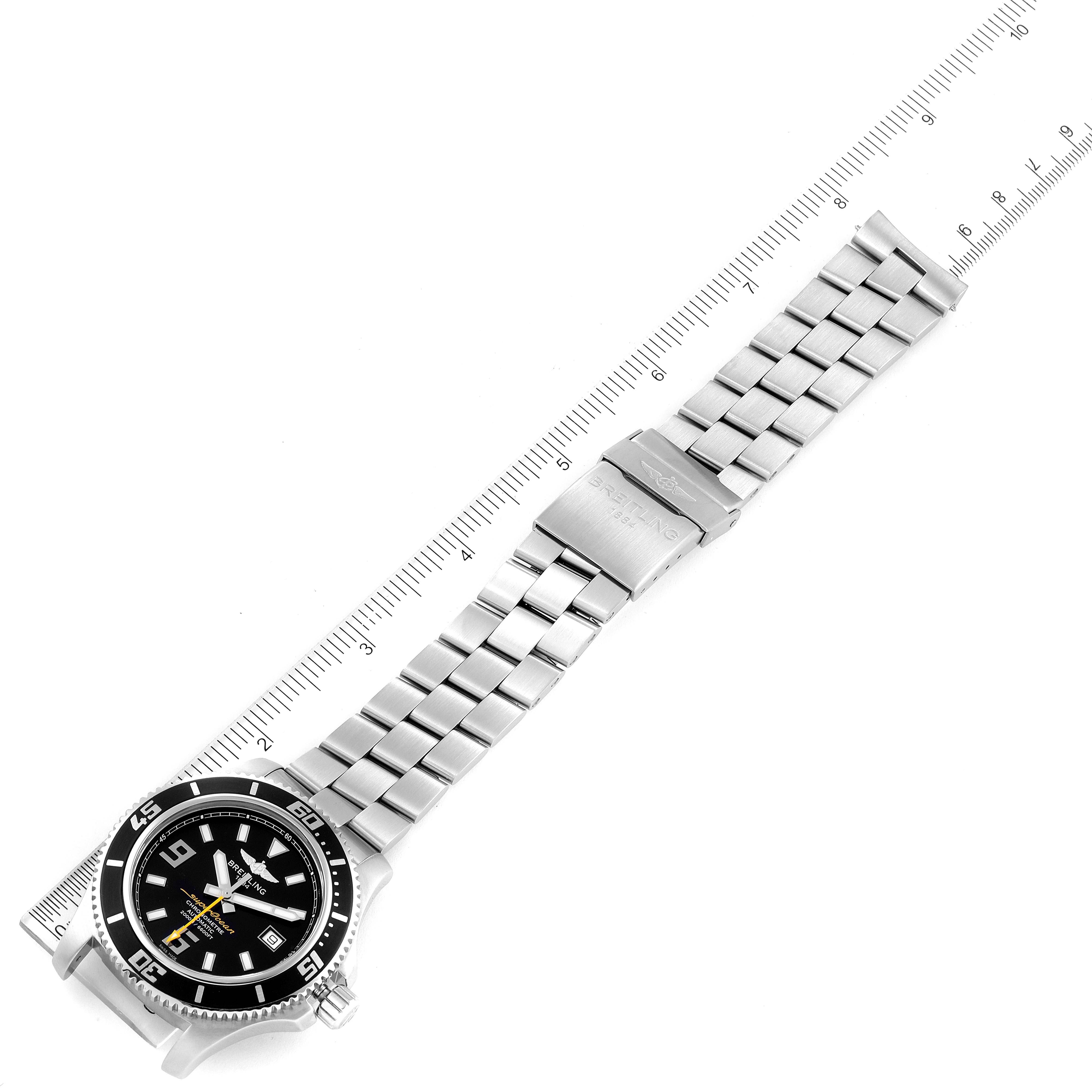 The image displays a Breitling Superocean A17391 Men's Stainless Steel Black Dial A17391 Men's Stainless Steel Black Dial watch from an overhead angle, highlighting the watch face and metal bracelet with a ruler for scale.