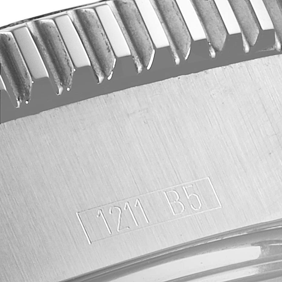 This image shows a close-up of the engraved case back and the bezel edge of a Breitling Superocean A17391 Men's Stainless Steel Black Dial A17391 Men's Stainless Steel Black Dial watch.