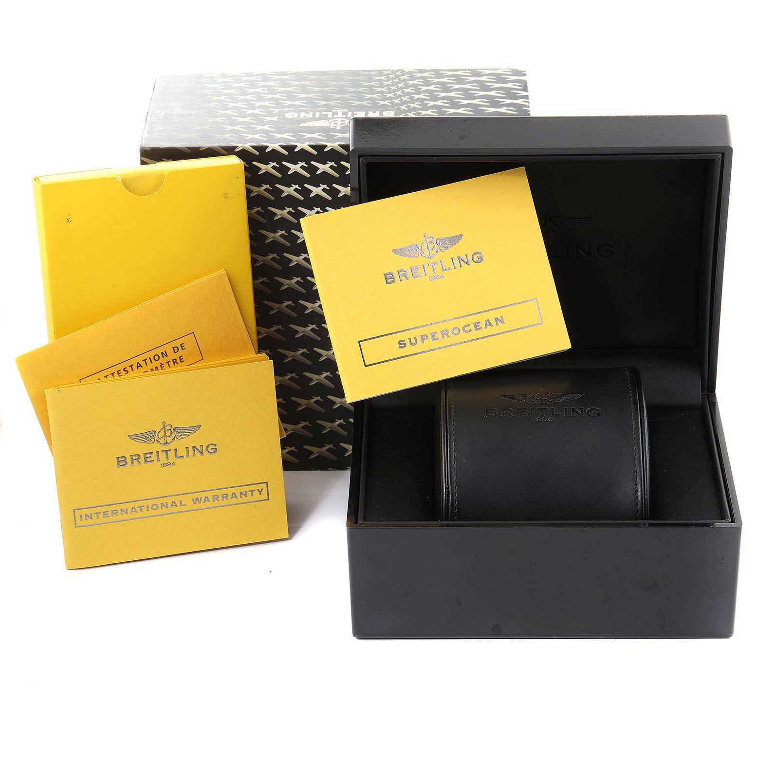 The image shows a Breitling Superocean A17391 Men's Stainless Steel Black Dial A17391 Men's Stainless Steel Black Dial watch box, warranty cards, and packaging materials at an angle including some parts.