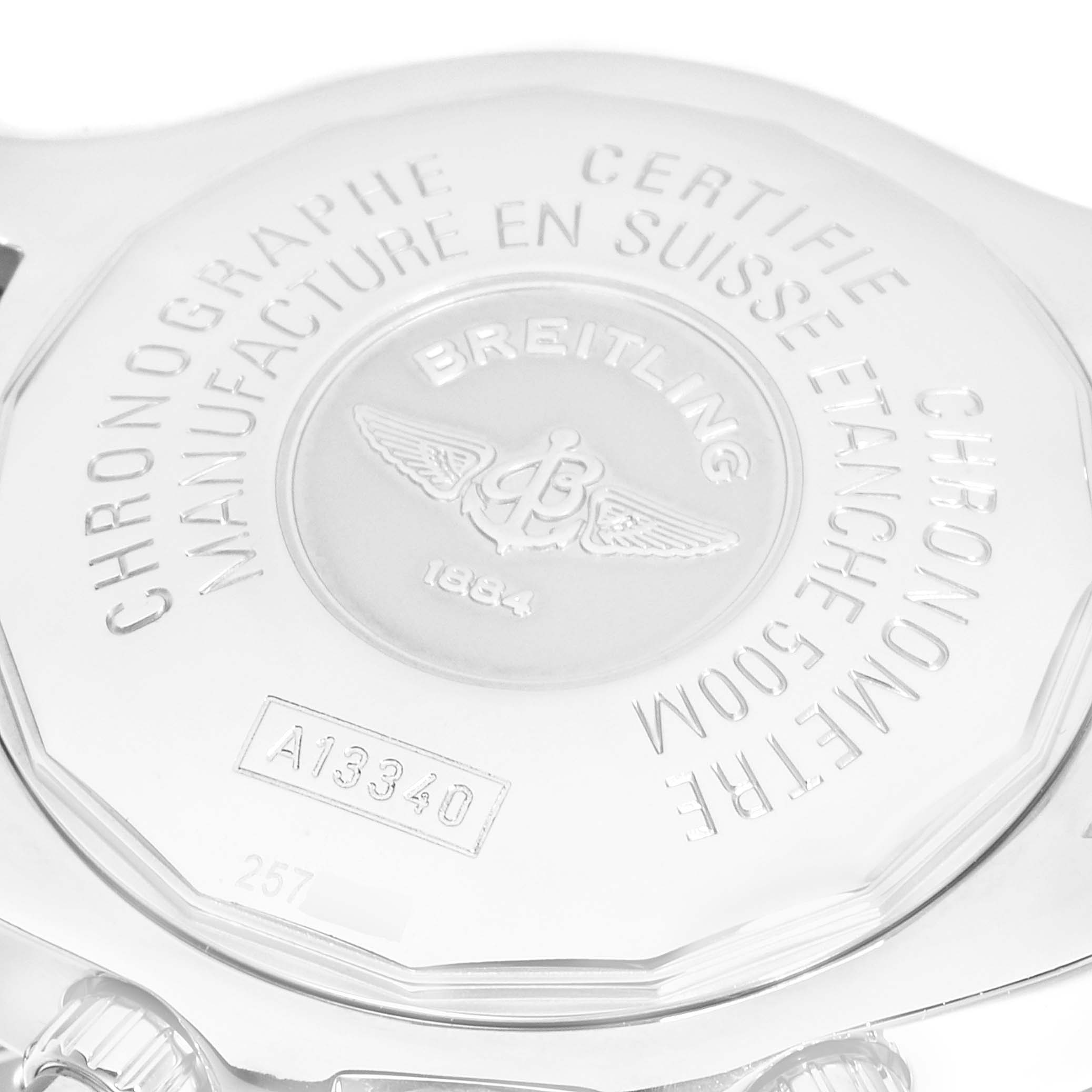 Close-up of the back case of a Breitling Superocean A13340 Men
s Stainless Steel Black Dial A13340 Men
s Stainless Steel Black Dial watch, showing engraved text and logo details.