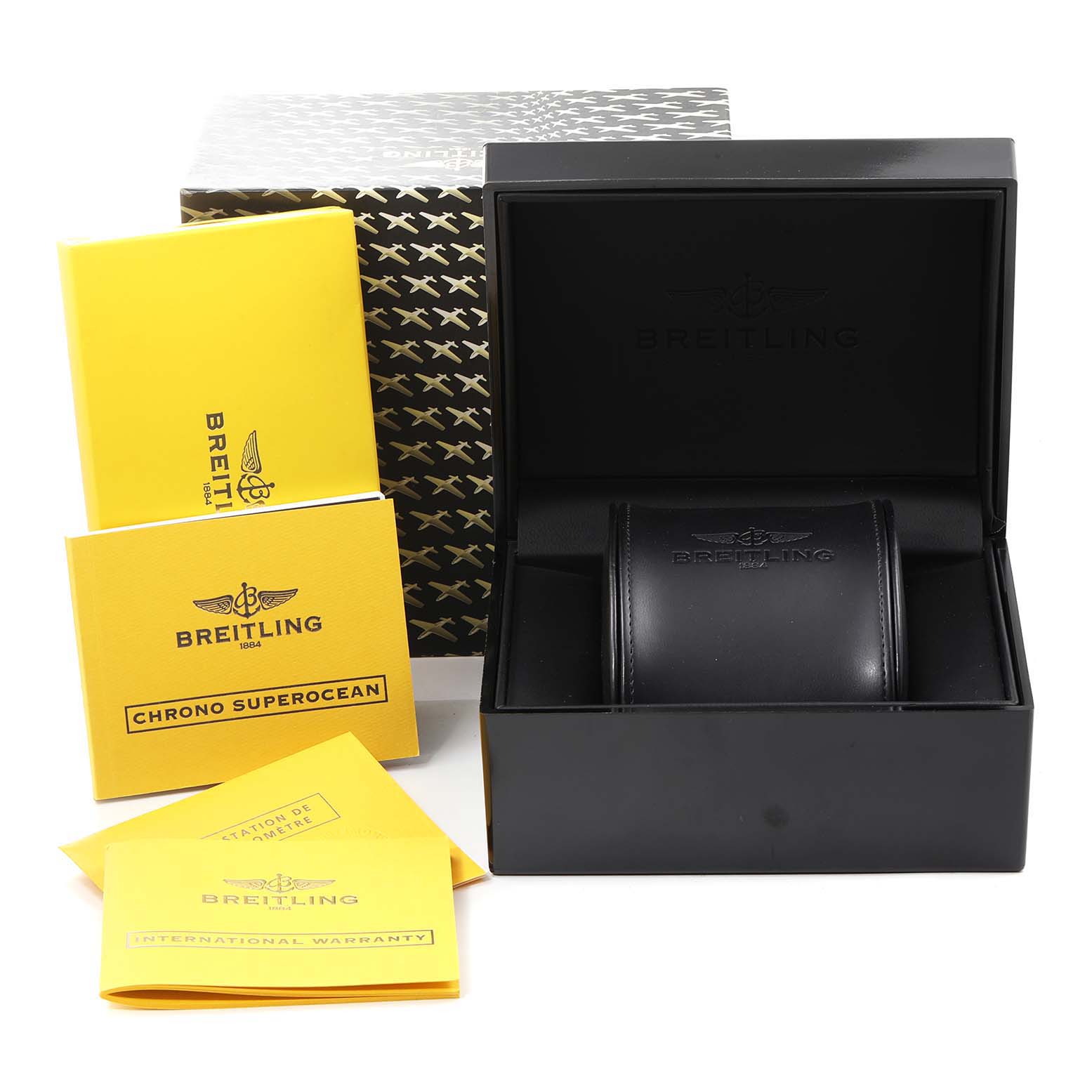 The image shows the packaging and accessories for a Breitling Superocean A13340 Men
s Stainless Steel Black Dial A13340 Men
s Stainless Steel Black Dial watch, including the box, manuals, and warranty papers.