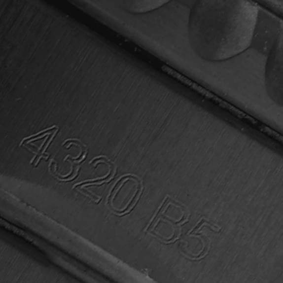 This image shows a close-up of the band of the Breitling Aviator A17315 Men's Stainless Steel Blue Dial, highlighting engraved numbers "4.320 B5" on the clasp.