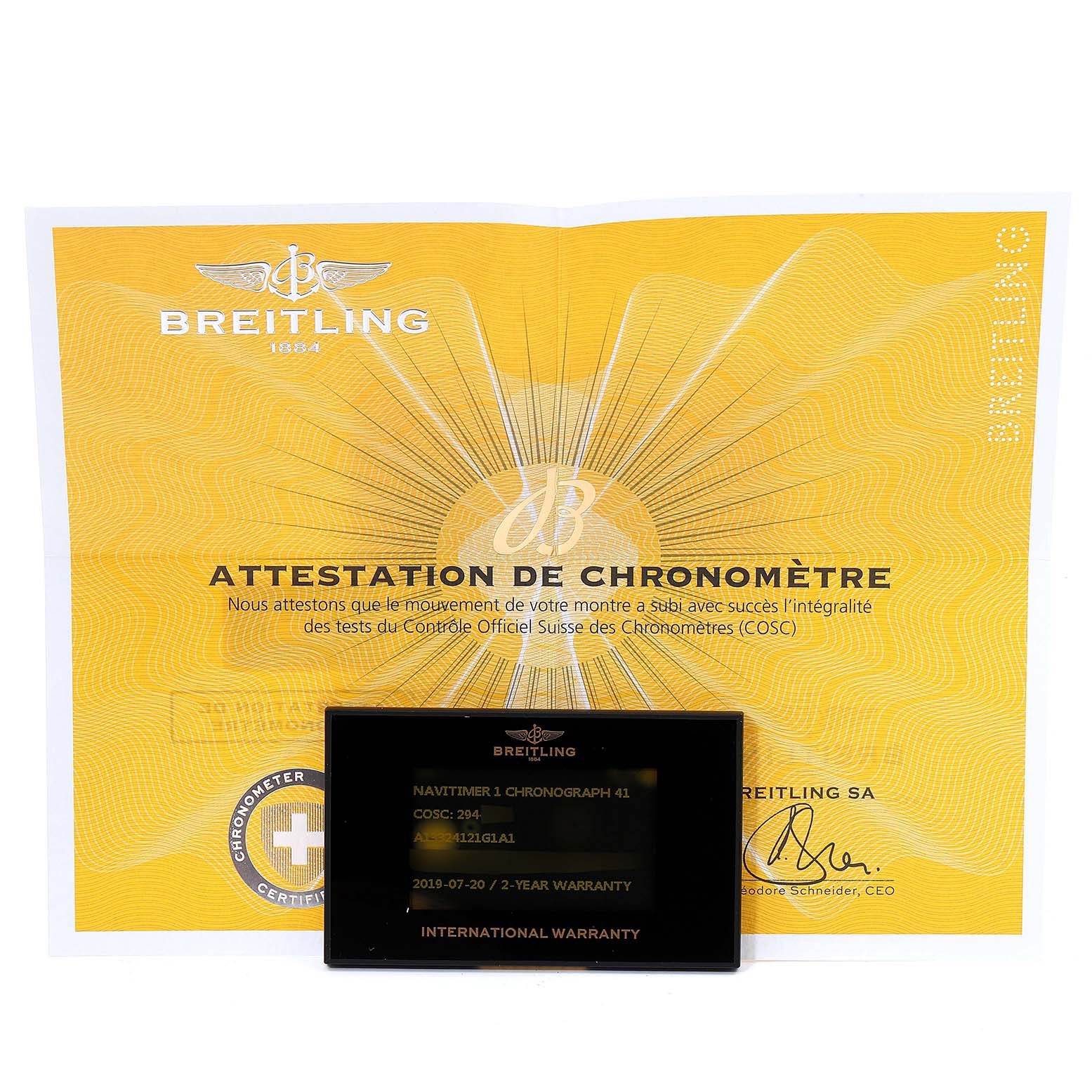 The image shows a warranty card and certificate for a Breitling Navitimer A13324 Men
s Stainless Steel Silver Dial A13324 Men
s Stainless Steel Silver Dial model.