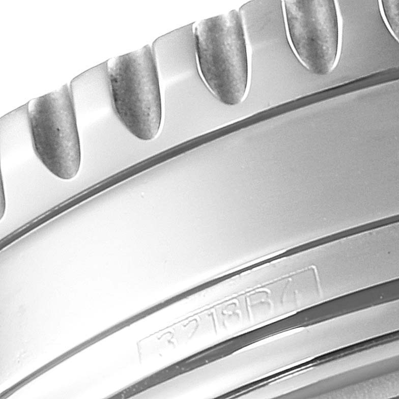 This close-up image shows the bezel and part of the case of a Breitling Navitimer A13324 Men
s Stainless Steel Silver Dial A13324 Men
s Stainless Steel Silver Dial watch.