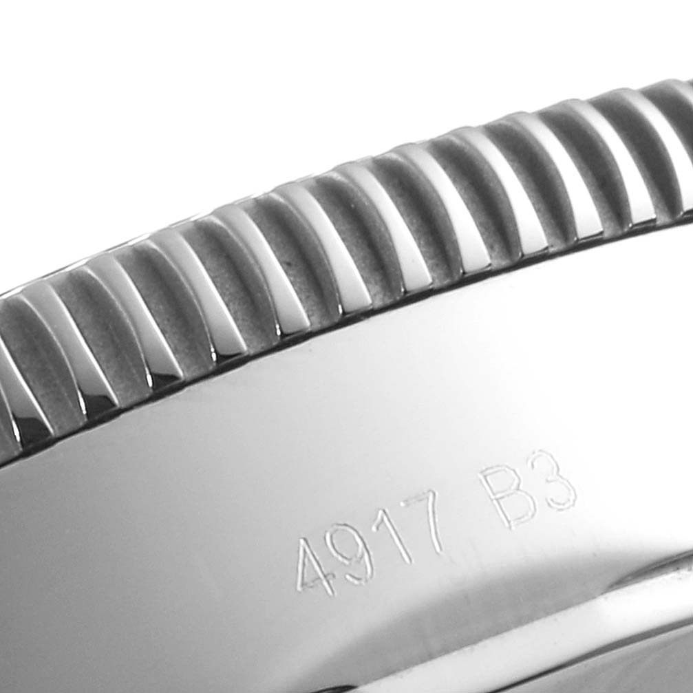 The image shows a close-up of the bezel and case side of the Breitling Superocean A13312 Men's Stainless Steel Blue Dial A13312 Men's Stainless Steel Blue Dial watch, with engravings on the case side.