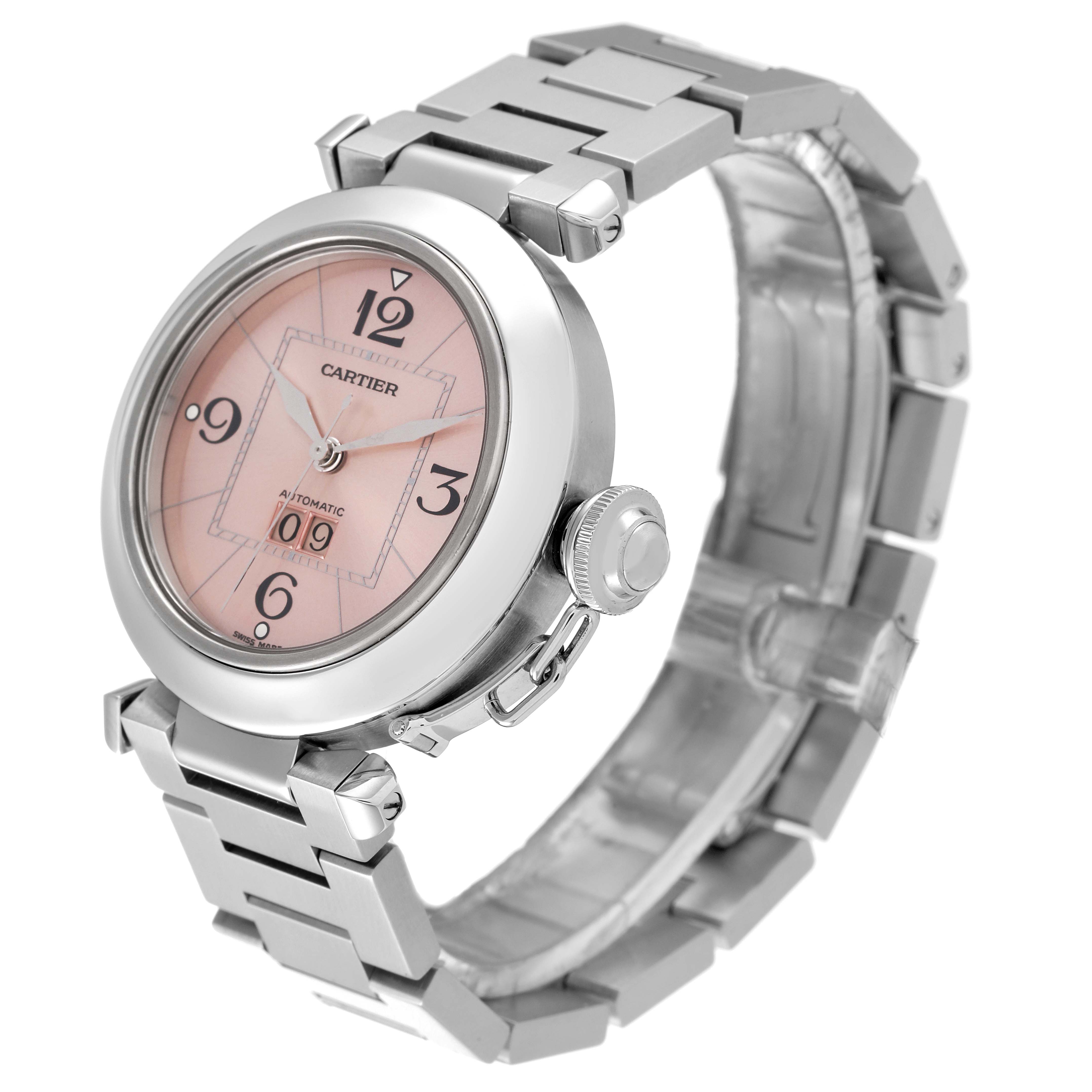 The Cartier Pasha W31058M7 Men's Stainless Steel Pink Dial W31058M7 Men's Stainless Steel Pink Dial watch is shown at an angled view, highlighting its pink dial, crown, and metal bracelet.