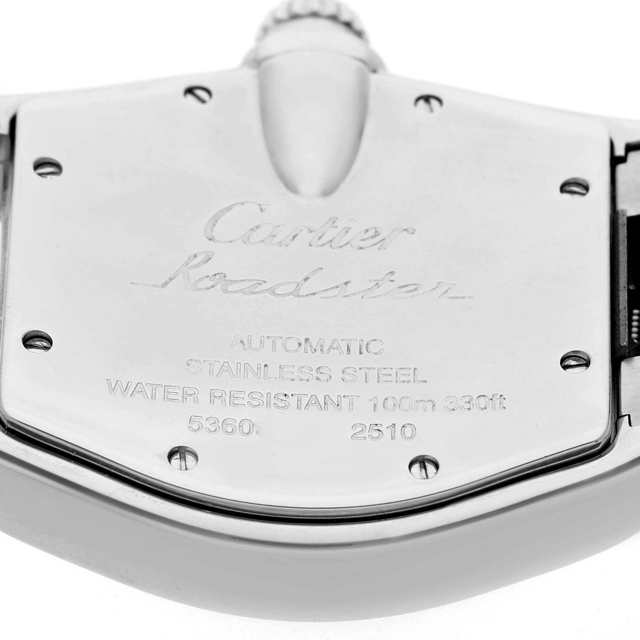 The image shows the back case of a Cartier Roadster W62041V3 Men's Stainless Steel Black Dial watch, featuring branding and specifications.