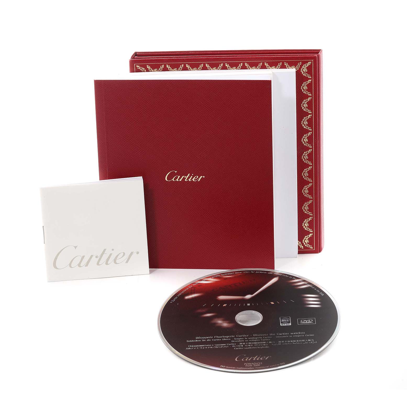 This image shows the packaging, booklet, and a CD for the Cartier Santos W20099C4 Men's Stainless Steel Silver Dial W20099C4 Men's Stainless Steel Silver Dial model watch.
