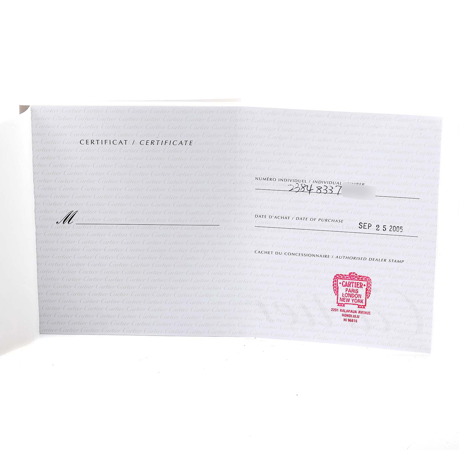 This image shows an open certificate of authenticity for a Cartier Tank Française watch, with dealer stamp and purchase date.