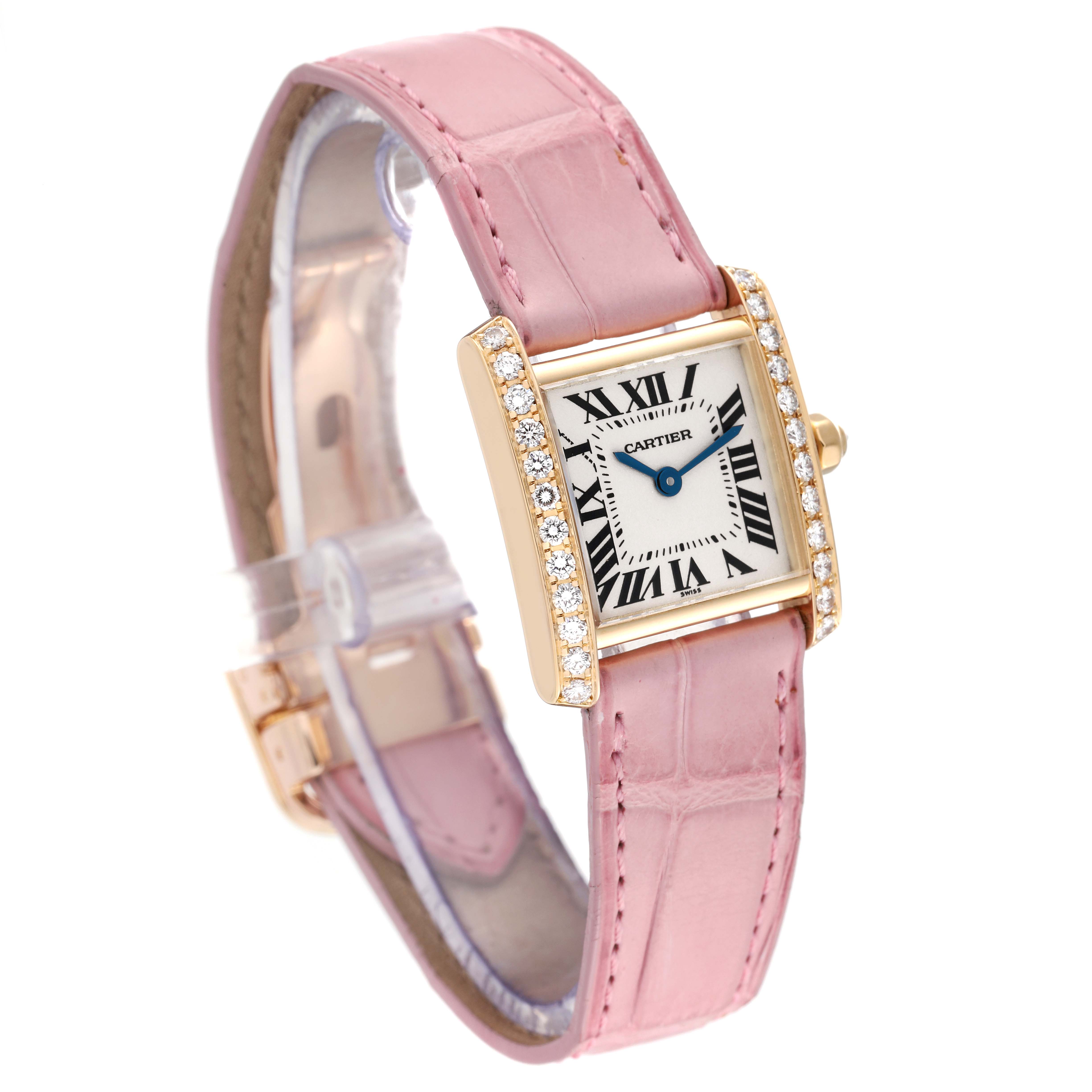 The image shows a Cartier Tank Francaise WE100151 Women's Yellow Gold Silver Dial WE100151 Women's Yellow Gold Silver Dial watch at an angle highlighting its pink strap and diamond-set rectangular case.