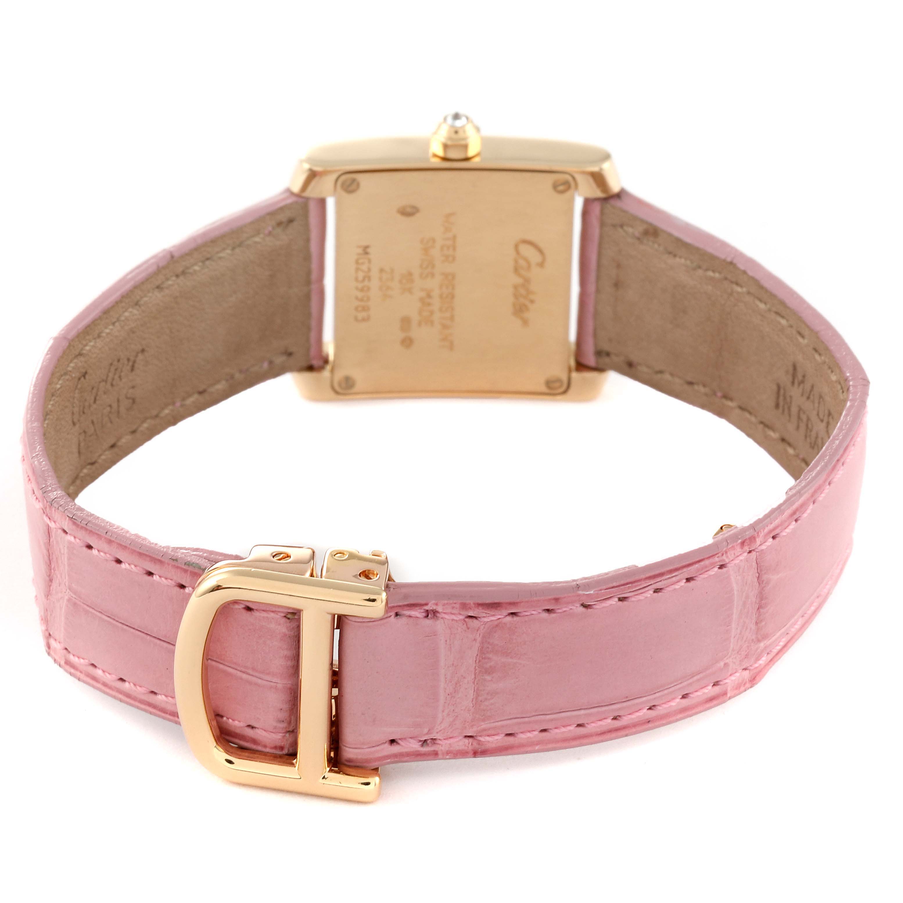 The image shows the back view of a Cartier Tank Francaise WE100151 Women's Yellow Gold Silver Dial WE100151 Women's Yellow Gold Silver Dial watch, highlighting its pink strap and engraved case back.
