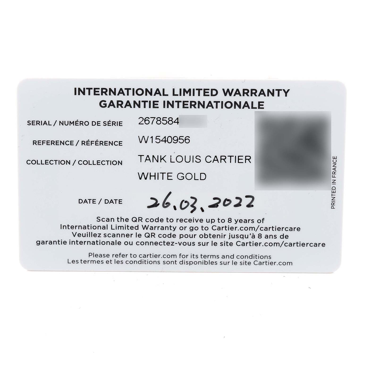 This image shows an international limited warranty card for the Cartier Tank Louis W1540956 Men's White Gold Silver Dial W1540956 Men's White Gold Silver Dial watch in white gold, dated 26.03.2022.