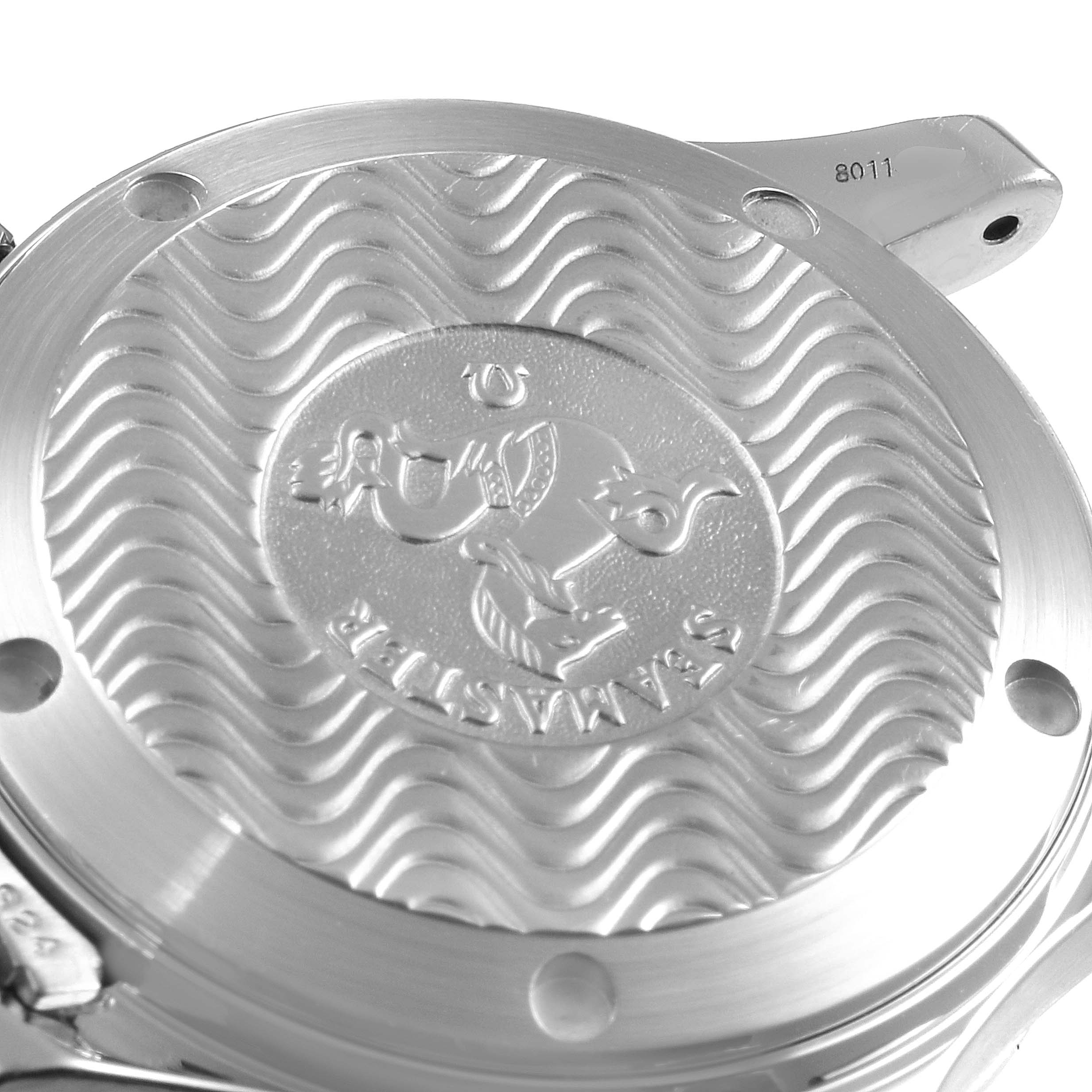 This image shows a close-up of the case back of an Omega Seamaster 2551.80.00 Men
s Stainless Steel Blue Dial 2551.80.00 Men
s Stainless Steel Blue Dial watch, highlighting the engraved design and wave pattern.