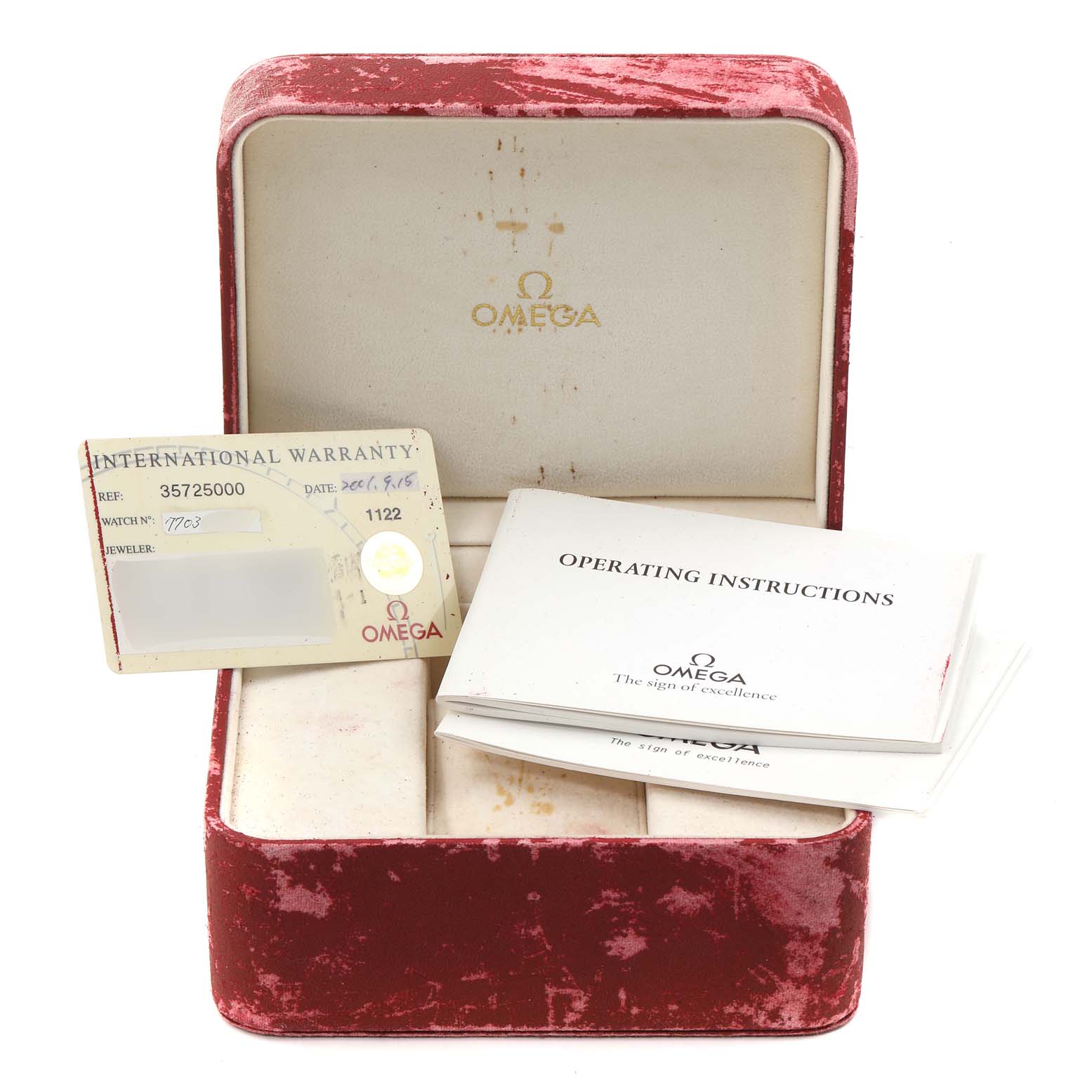 The image shows a red Omega Speedmaster 3572.50.00 Men
s Stainless Steel Black Dial 3572.50.00 Men
s Stainless Steel Black Dial watch box, an international warranty card, and operating instructions.