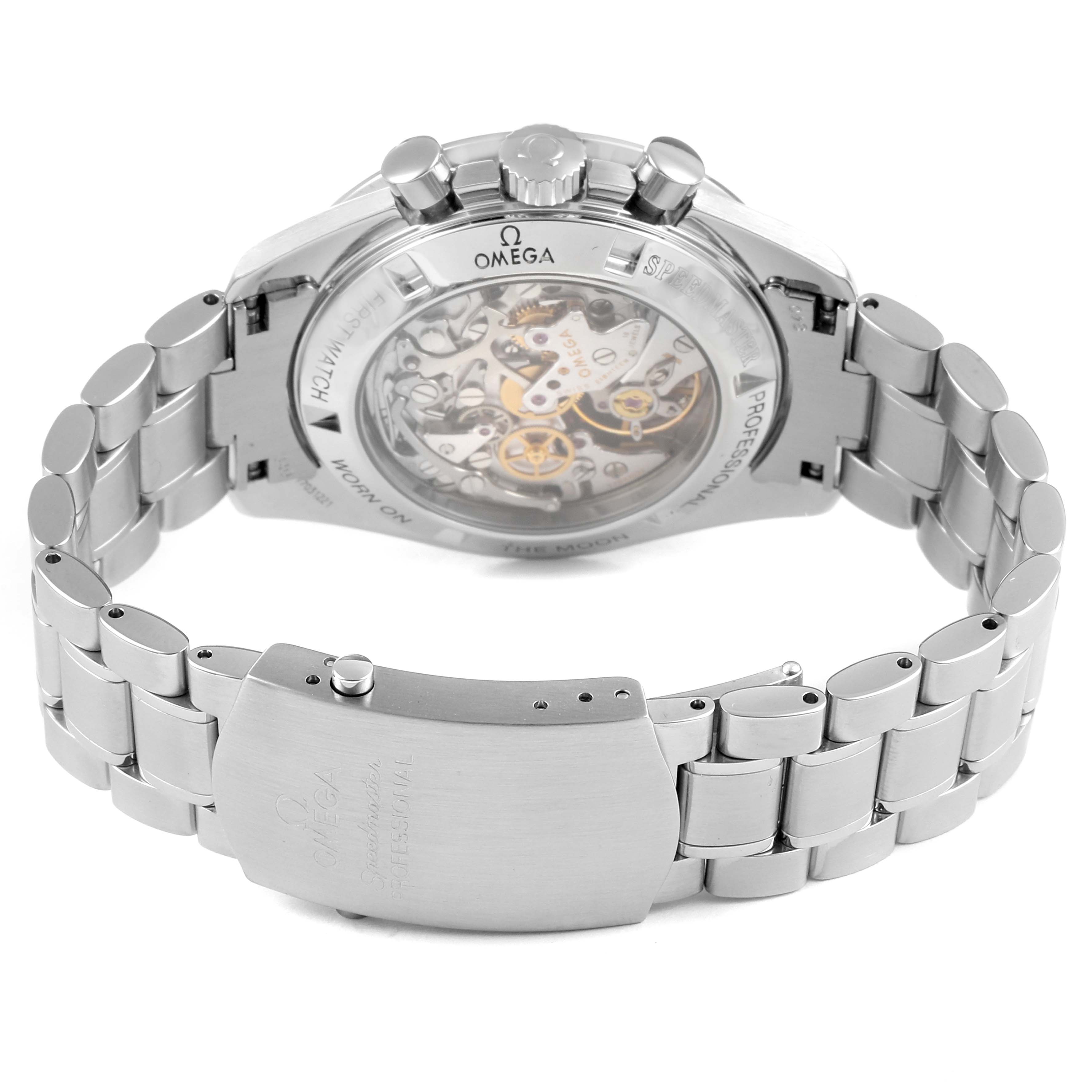 The image shows the back view of an Omega Speedmaster 3572.50.00 Men
s Stainless Steel Black Dial 3572.50.00 Men
s Stainless Steel Black Dial watch, highlighting its mechanical movement and metal bracelet.