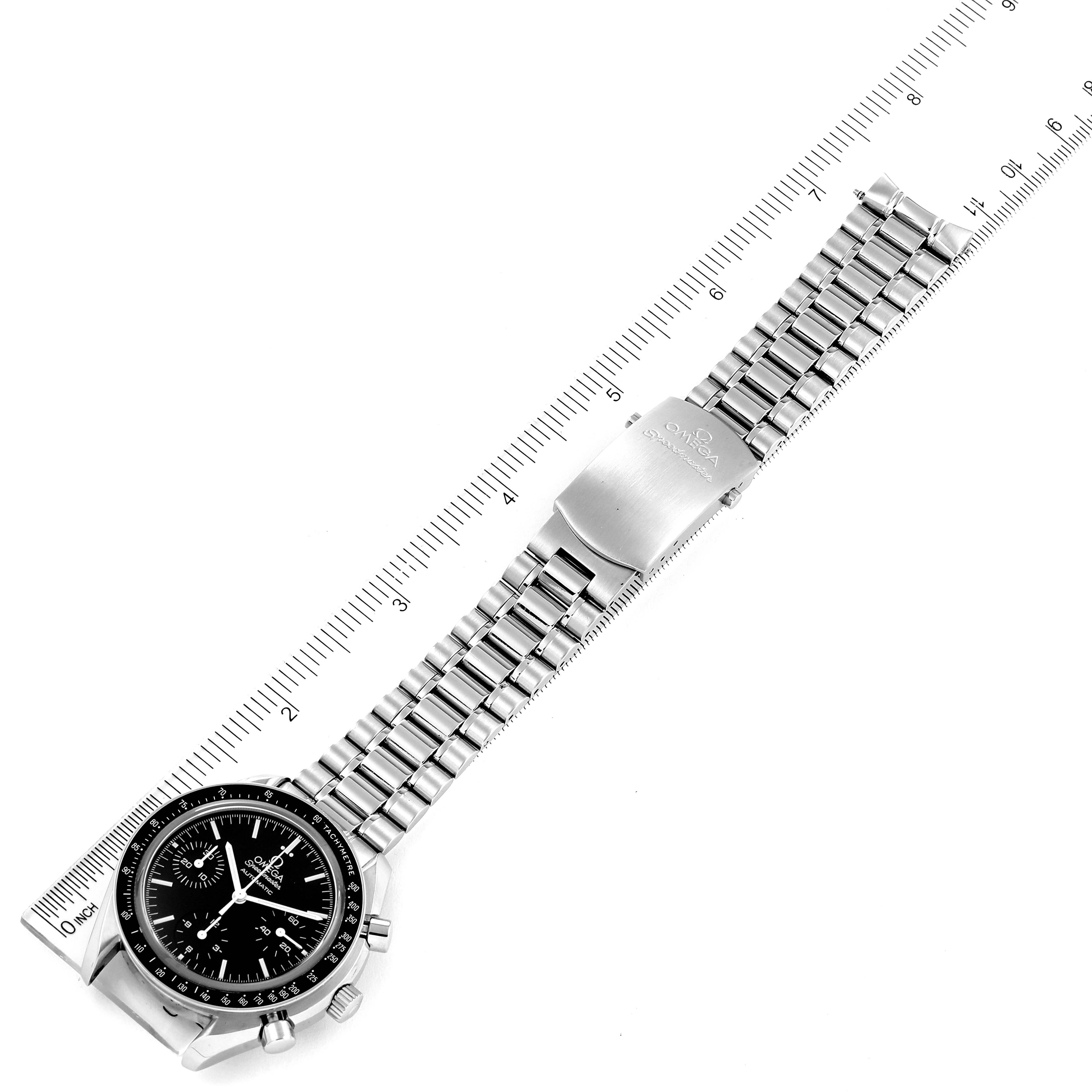 The image shows an Omega Speedmaster 3539.50.00 Men
s Stainless Steel Black Dial 3539.50.00 Men
s Stainless Steel Black Dial watch laid flat with its bracelet extended next to a ruler for scale.