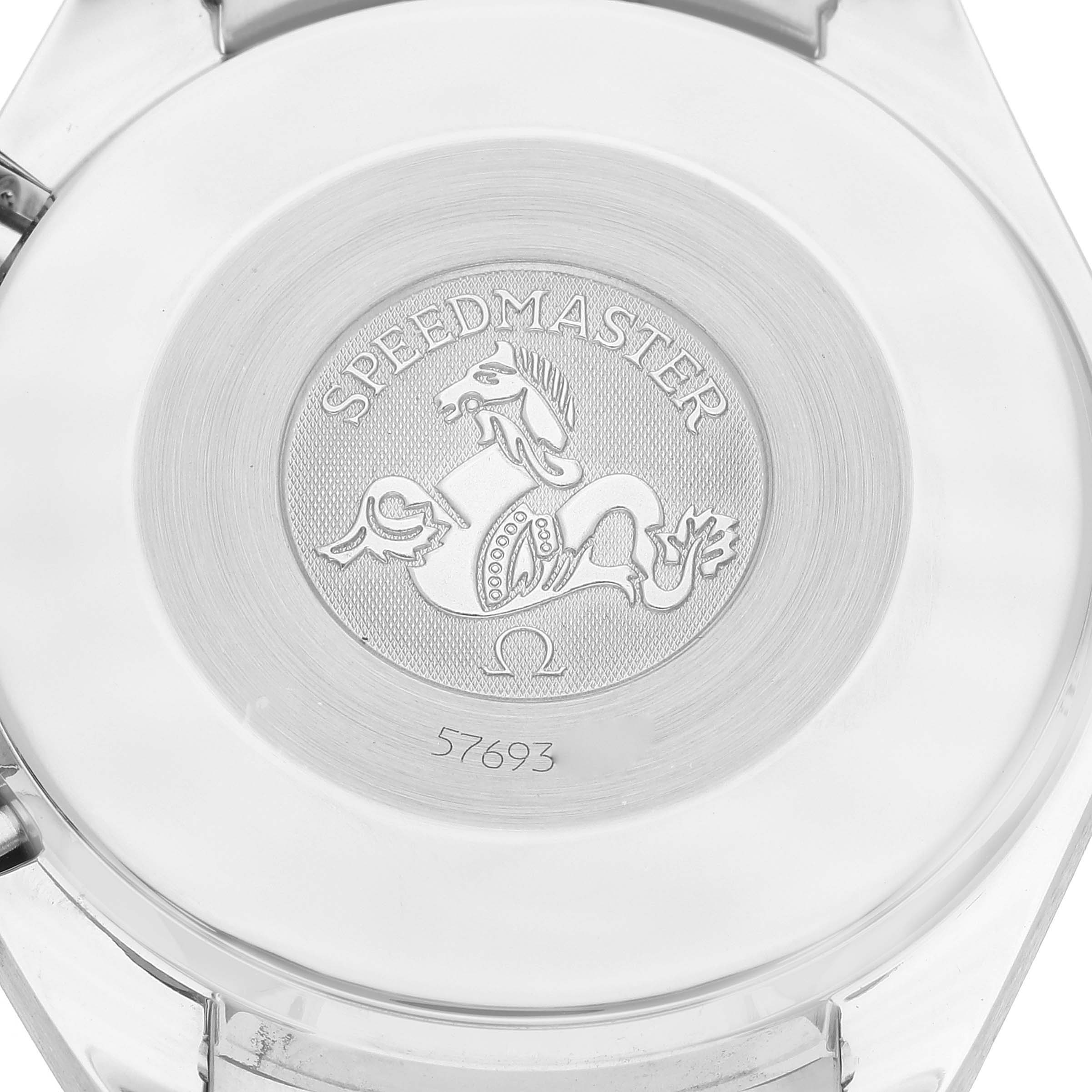 This image shows the case back of an Omega Speedmaster 3510.21.00 Men's Stainless Steel Silver Dial 3510.21.00 Men's Stainless Steel Silver Dial watch, highlighting the engraved logo and serial number.