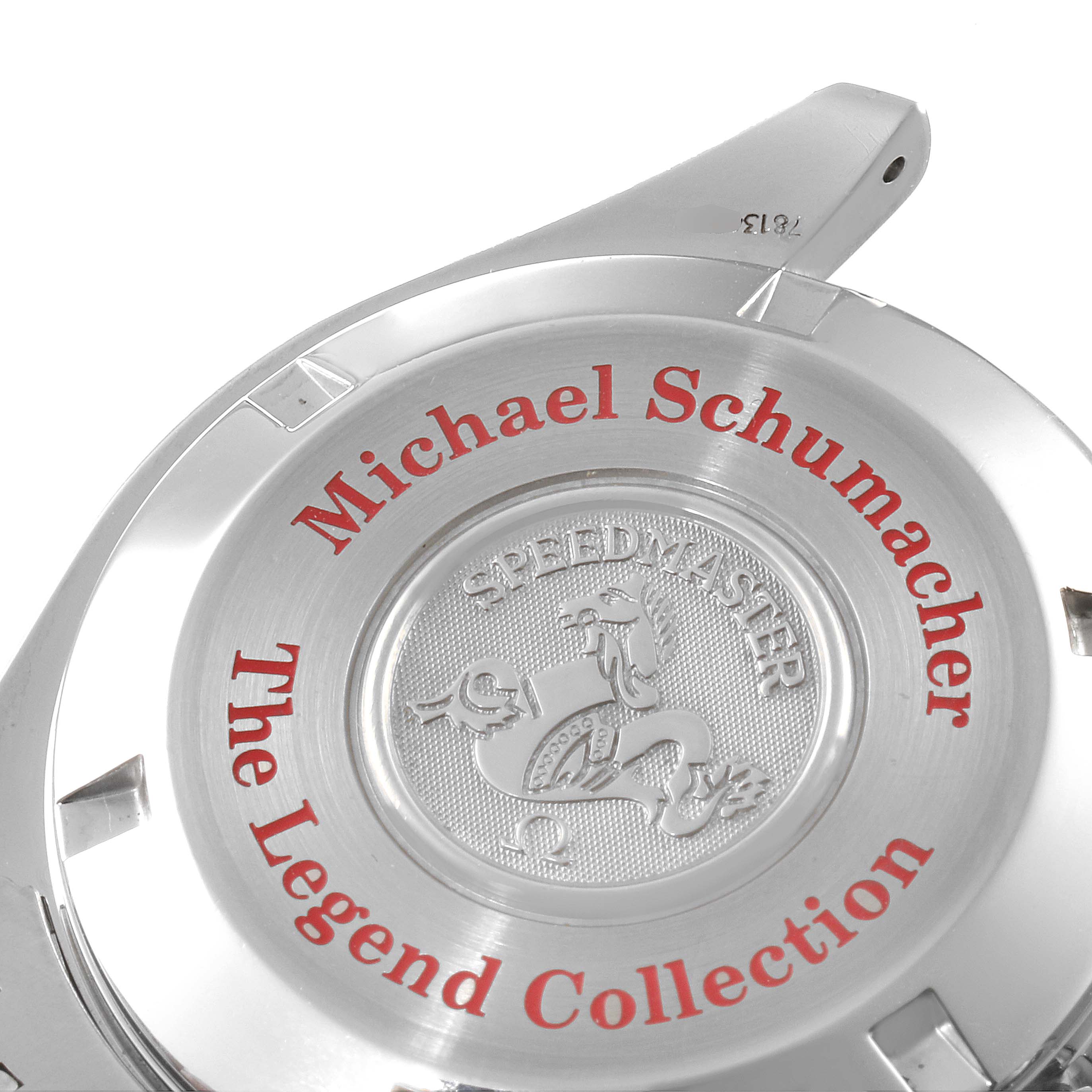 The image shows the case back of an Omega Speedmaster 3506.31.00 Men's Stainless Steel Silver Dial 3506.31.00 Men's Stainless Steel Silver Dial watch with "Michael Schumacher The Legend Collection" inscribed.